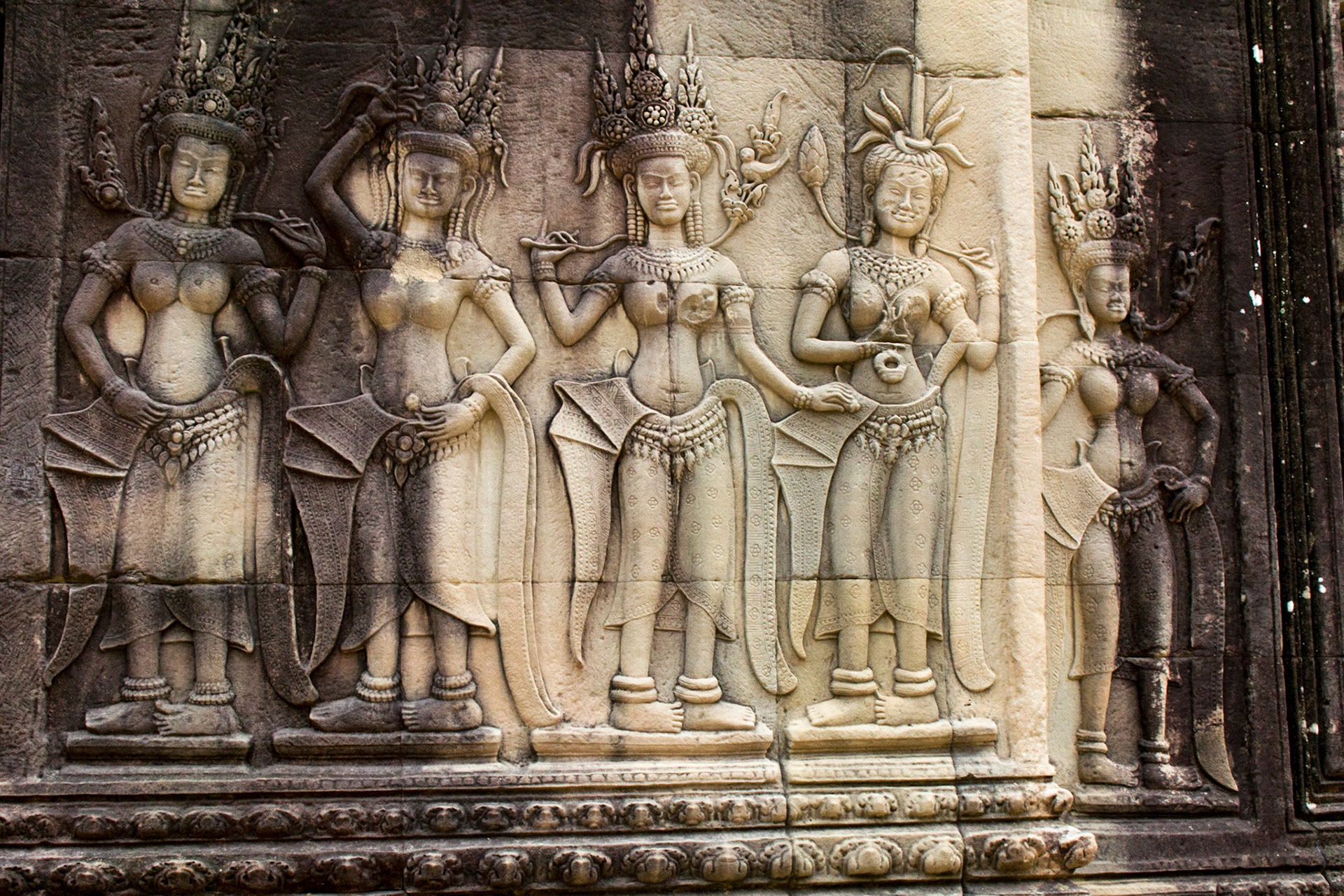 Devatas carvings adorn the columns and walls.