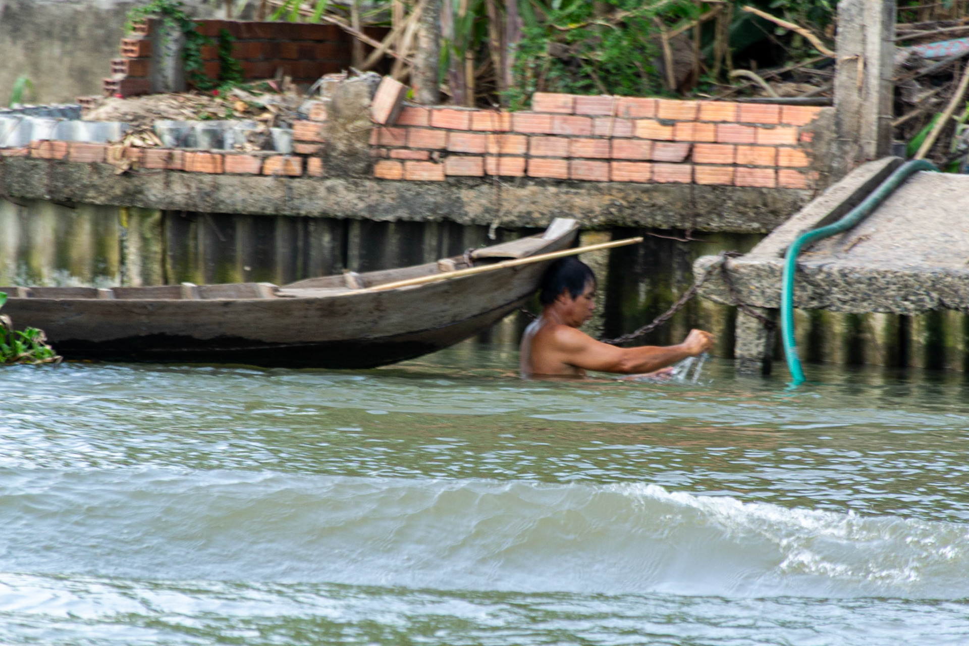 Sailing into Sa Dec village we observe locals enjoying the waters of the Mekong ......bathing,