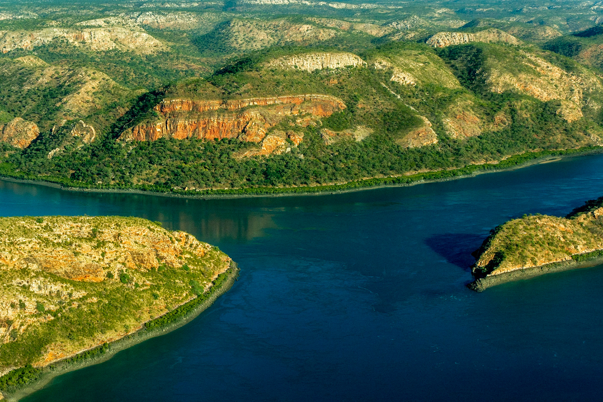 The colours of Talbot Bay and the adjacent rugged terrain are a spectacular sight from above.