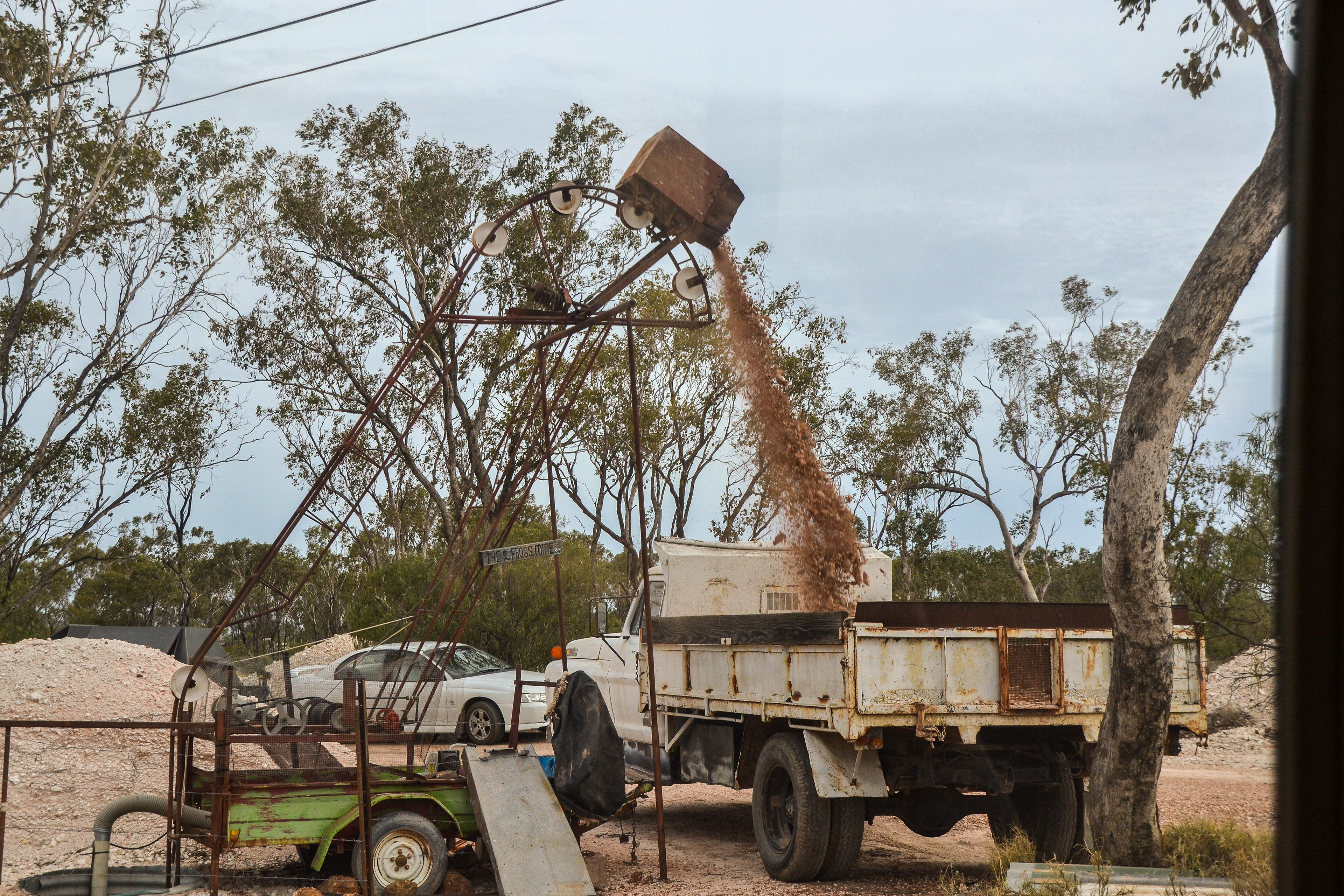 Mining in operation - the ingenious invention lifts ore from the mine shaft and loads a truck.