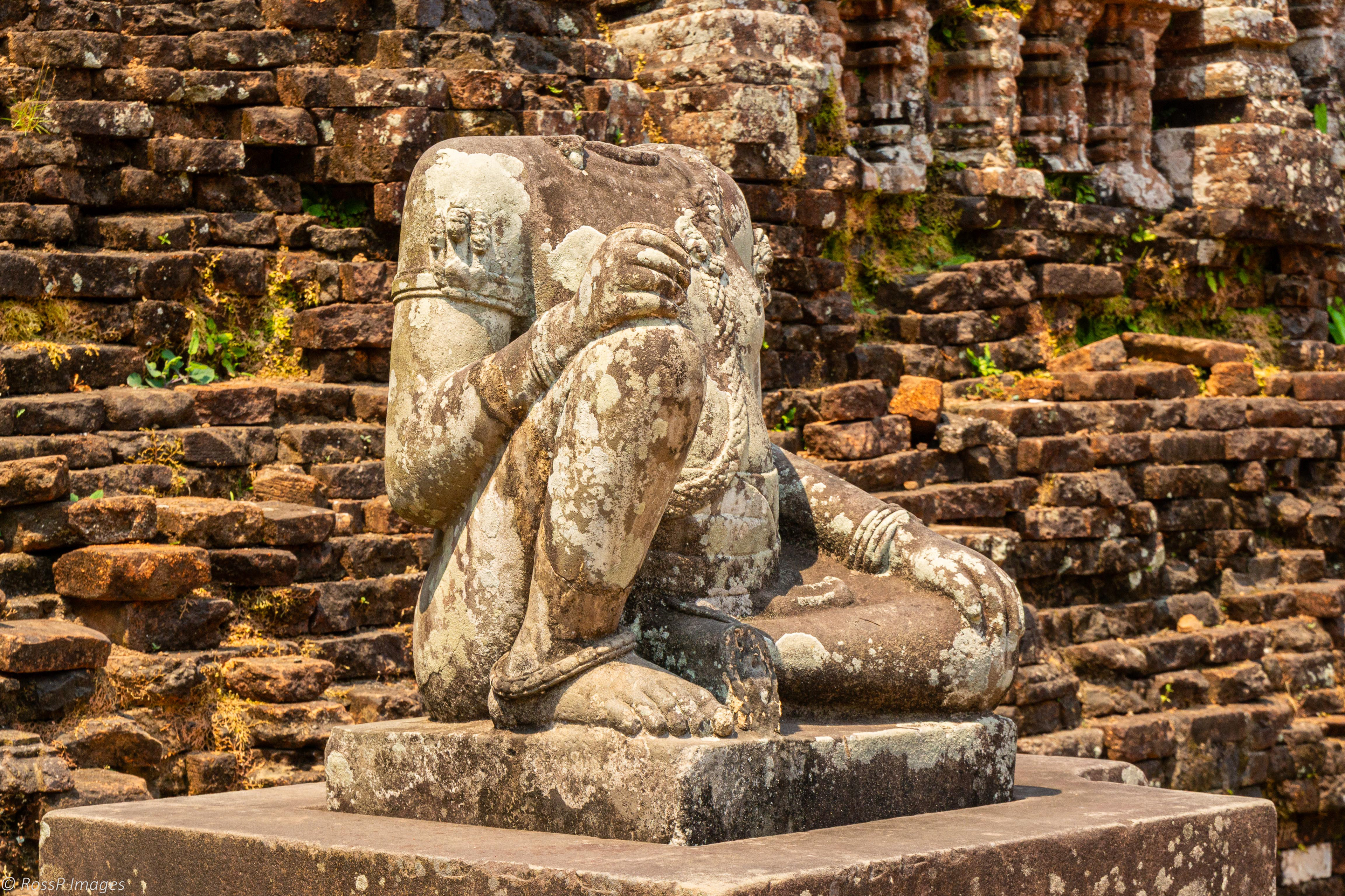 A headless sandstone sculpture of a Hindu diety.