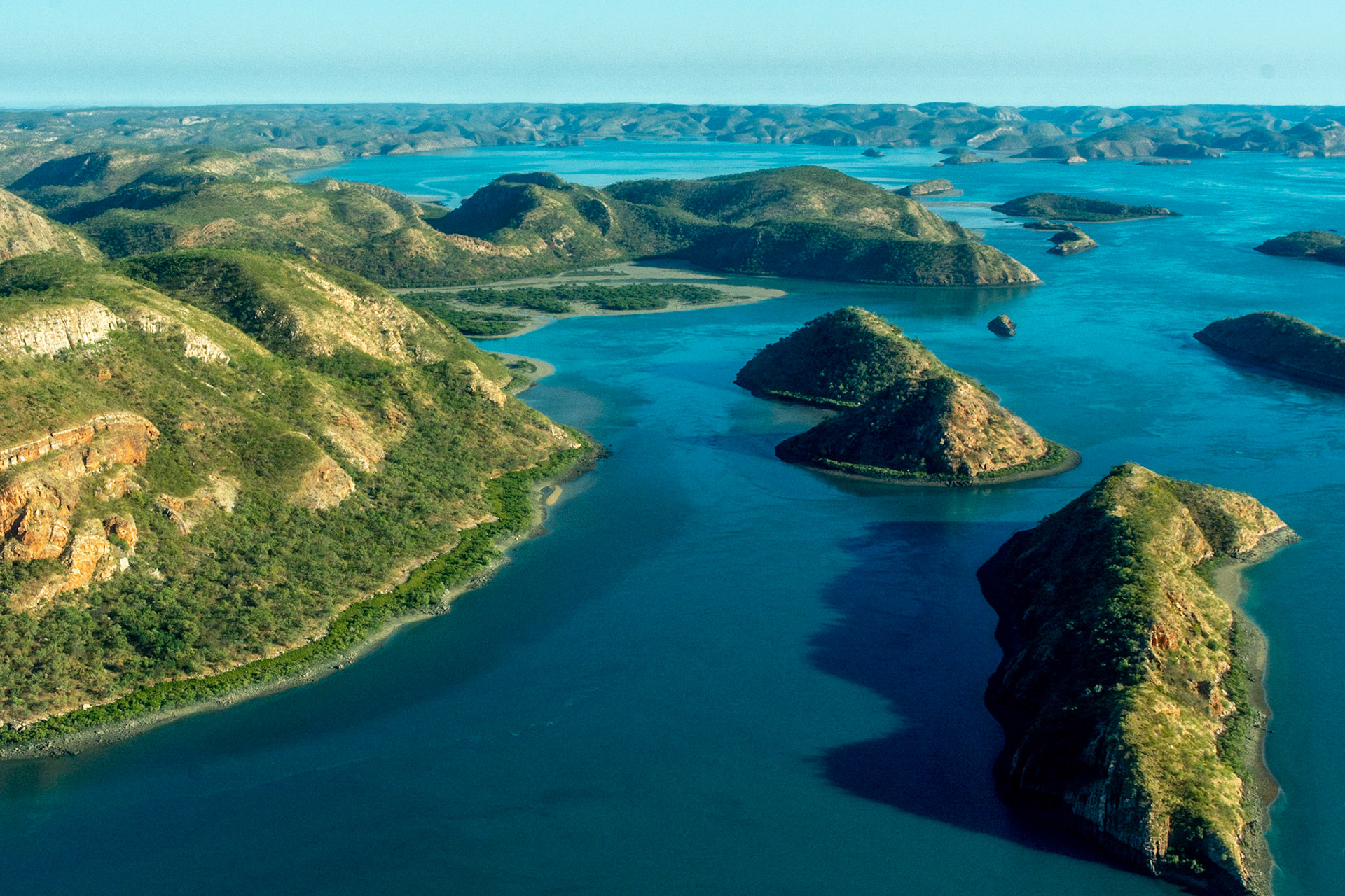 The rugged and pristine terrain of the Buccaneer Archipeligo stretch beyond the horizon.