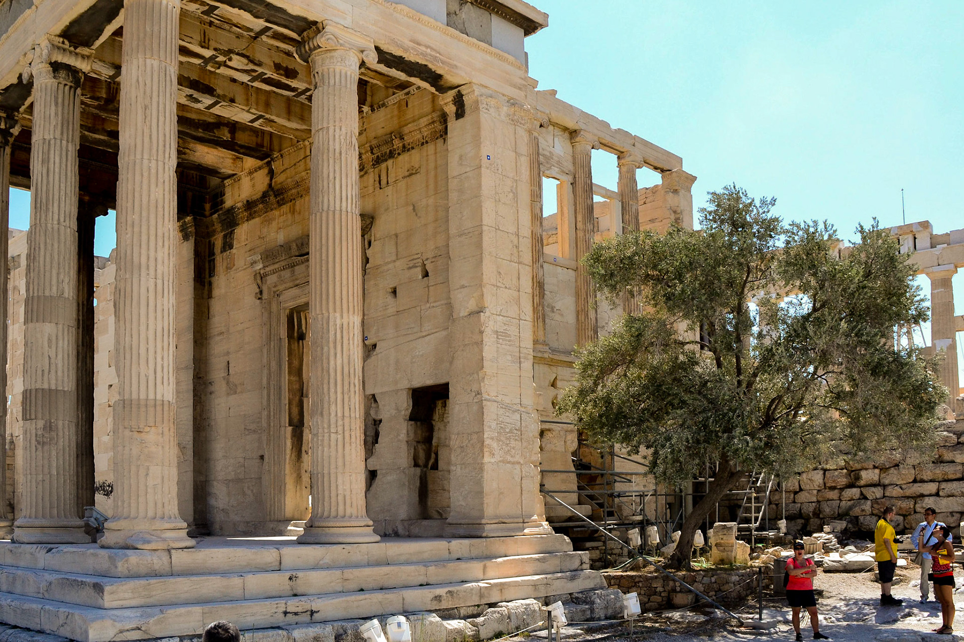 Waiting in the shade by the columns of the Erechtheion.