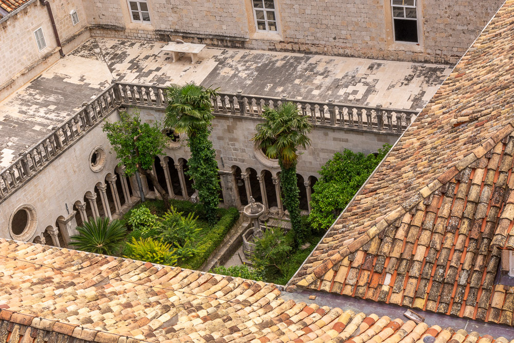 A birds eye view of the Franciscan Monastry's central courtyard and it's surrounding cloisters from the city walls.