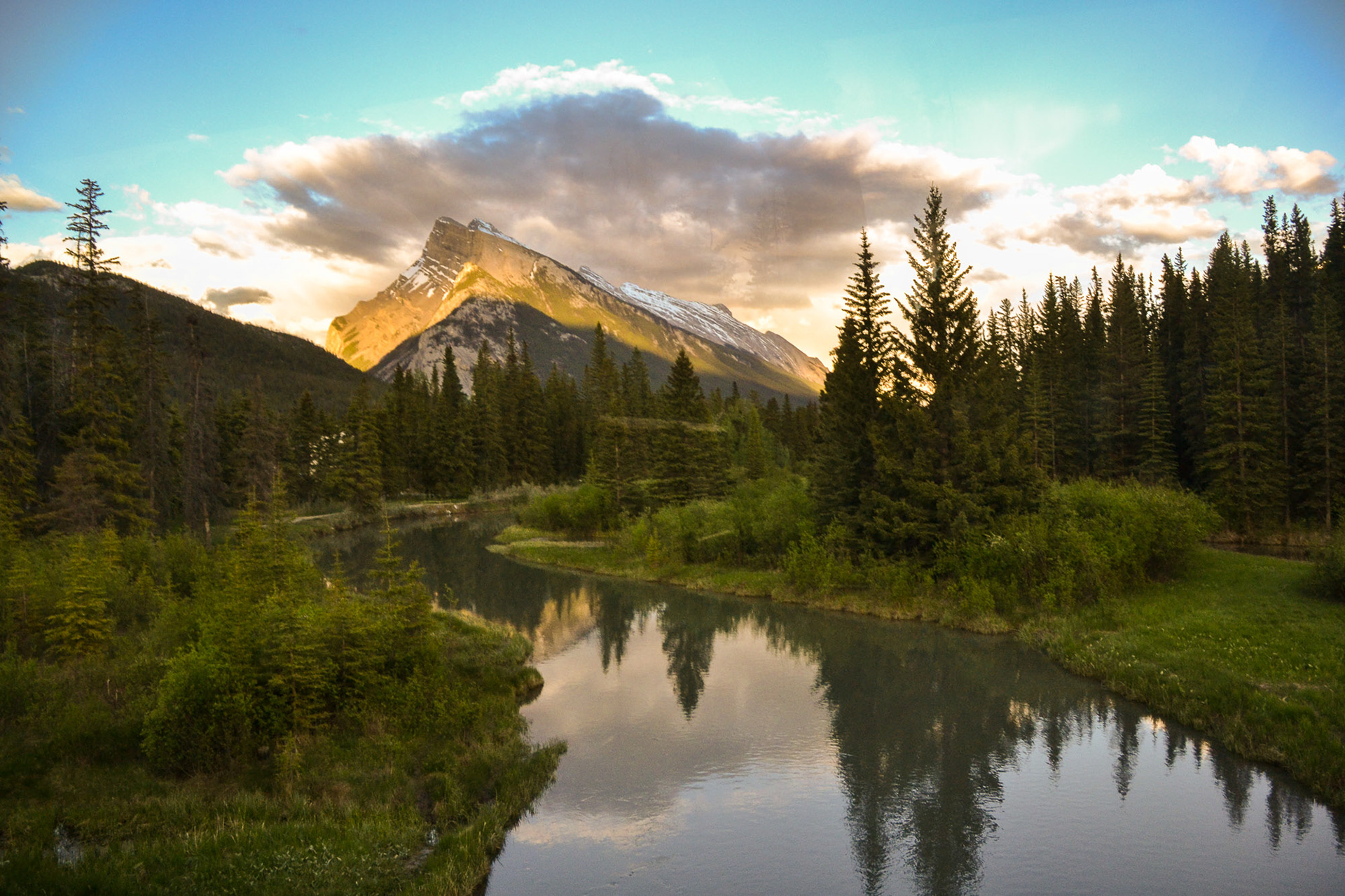 Sun highlights distant mountains and lengthening shadows greet us as we near our destination.