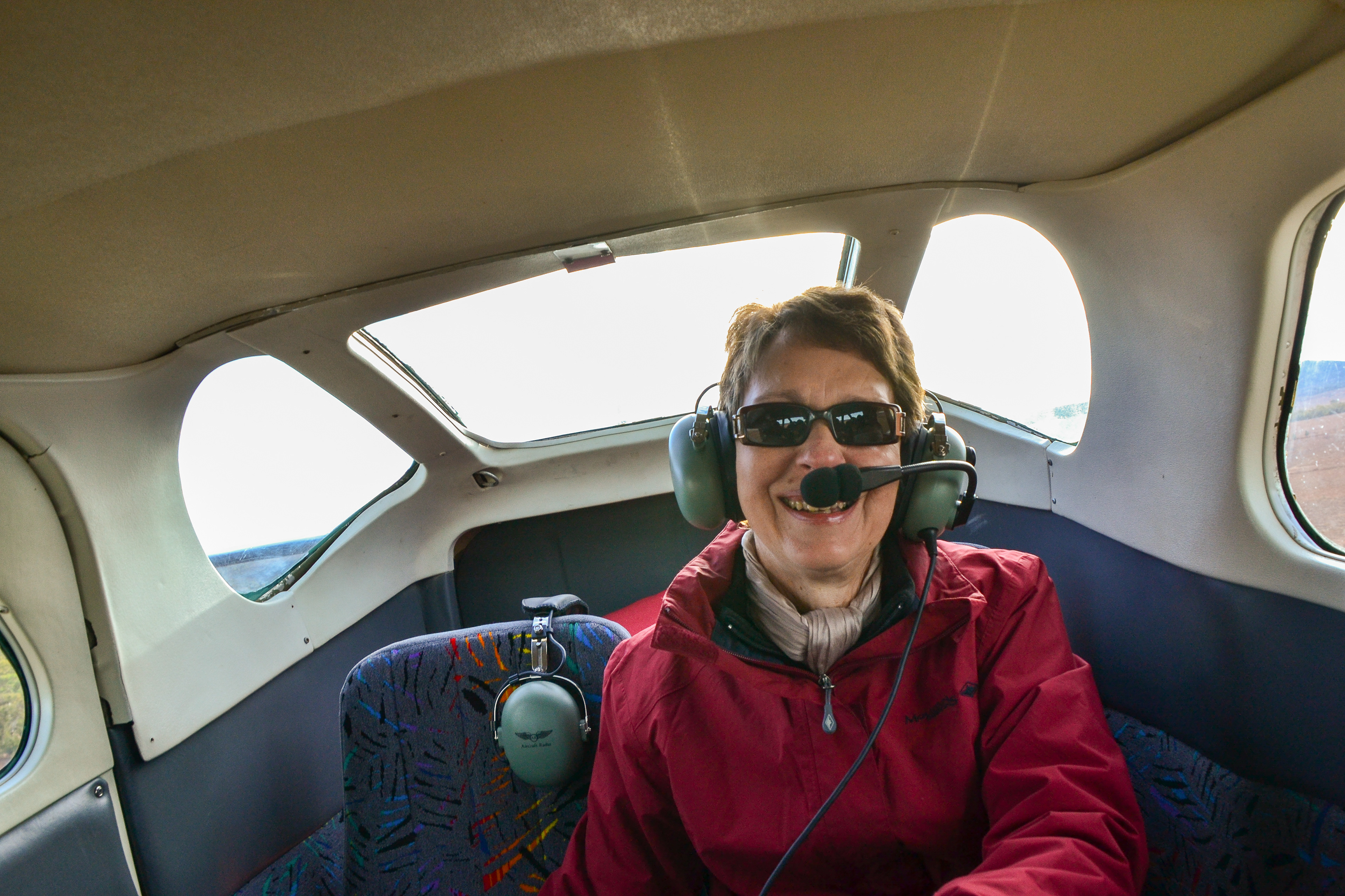 Lorraine enjoys the flight from the rear of the plane.