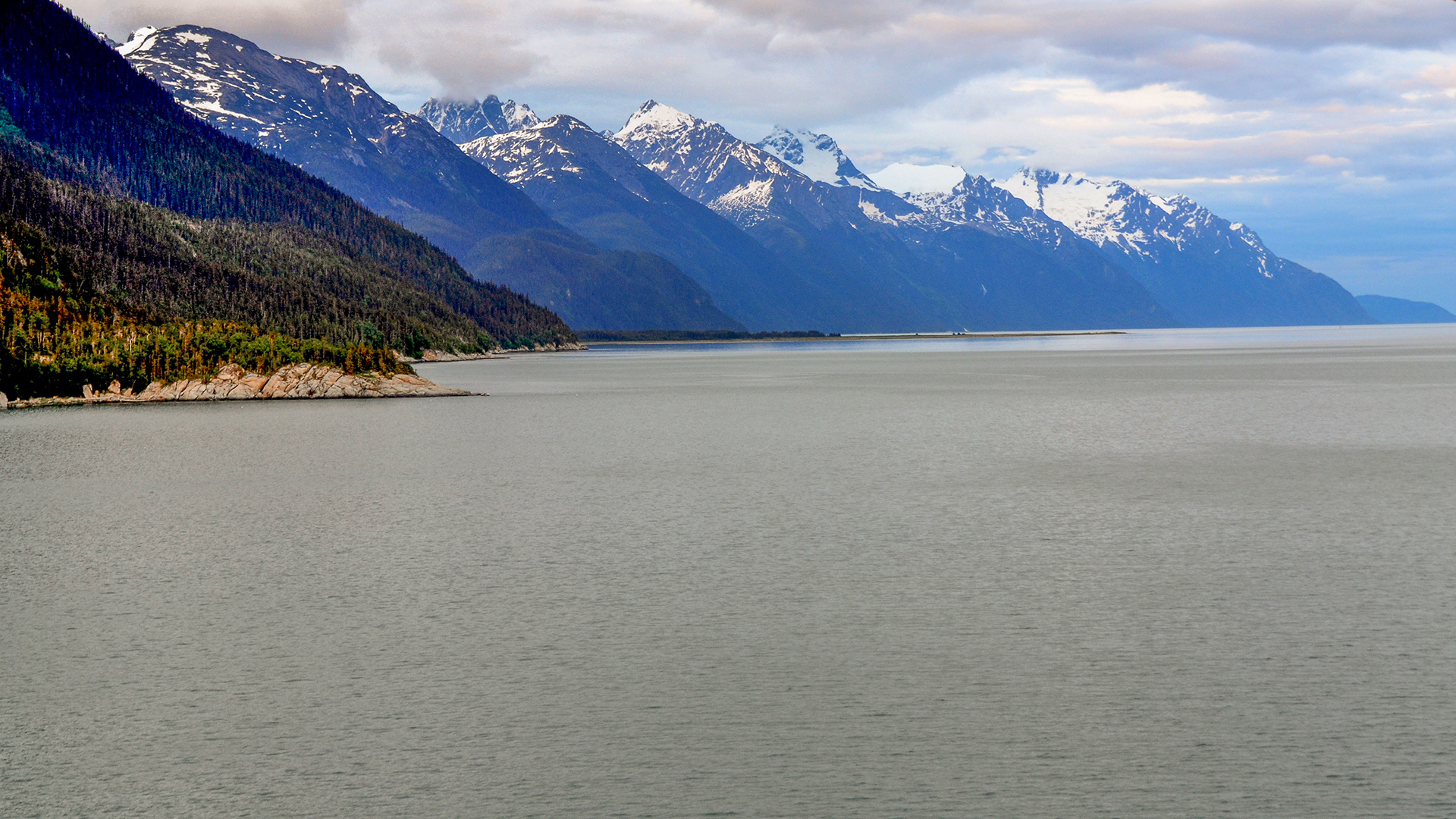 The spectacularly rugged snow-capped coastline as we make our way towards Glacier Bay.