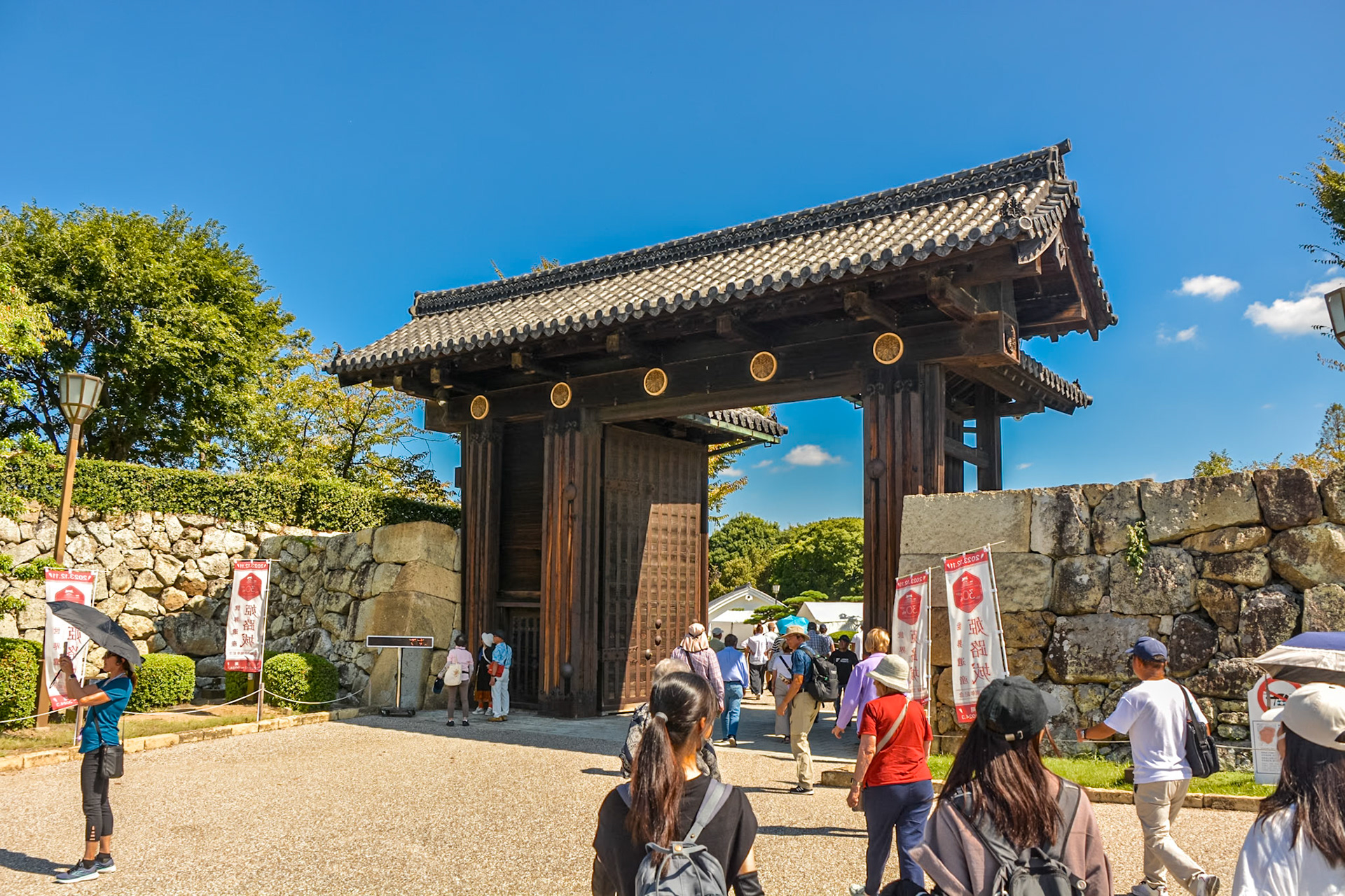 Visitors make their way through the main entrance gate to Himeji Castle.