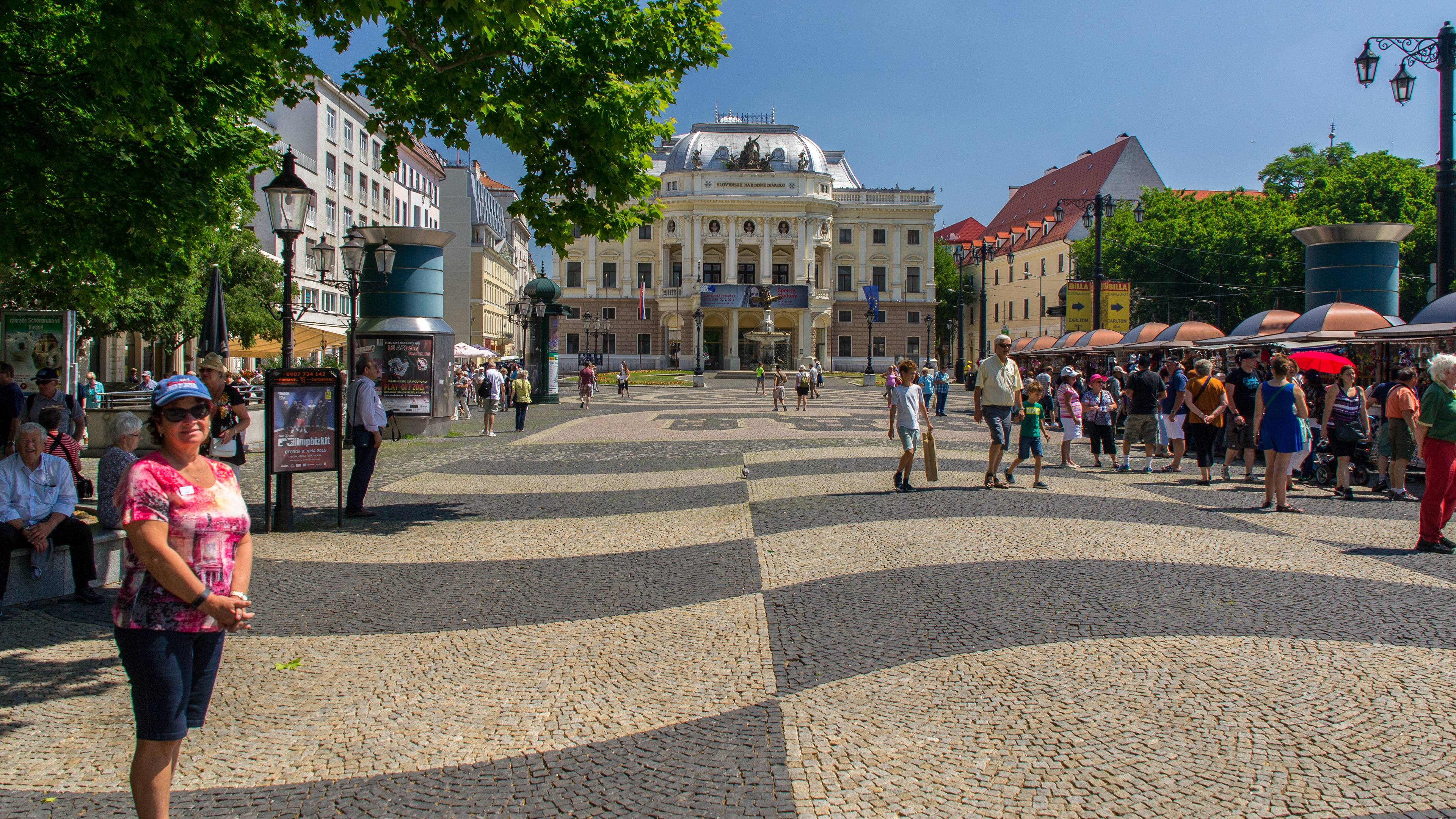 Cher in Hviezdoslav’s Square with the Slovak National Theatre in the background.