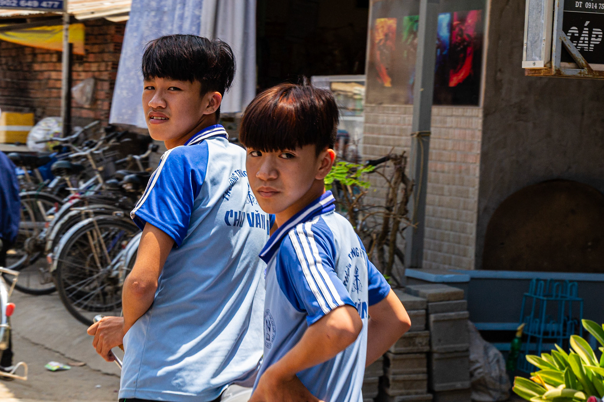 Schoolboys doubling on a bicycle