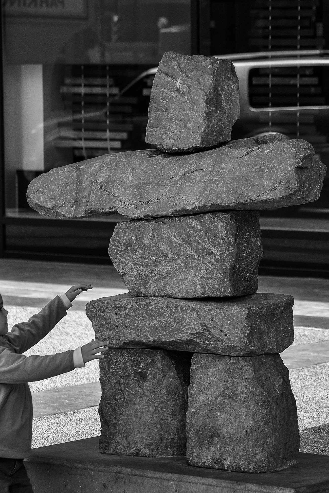 An Inuksuk -buitl from stone placed on stone may historically have been used for navigation or as a point of reference by first nations people..