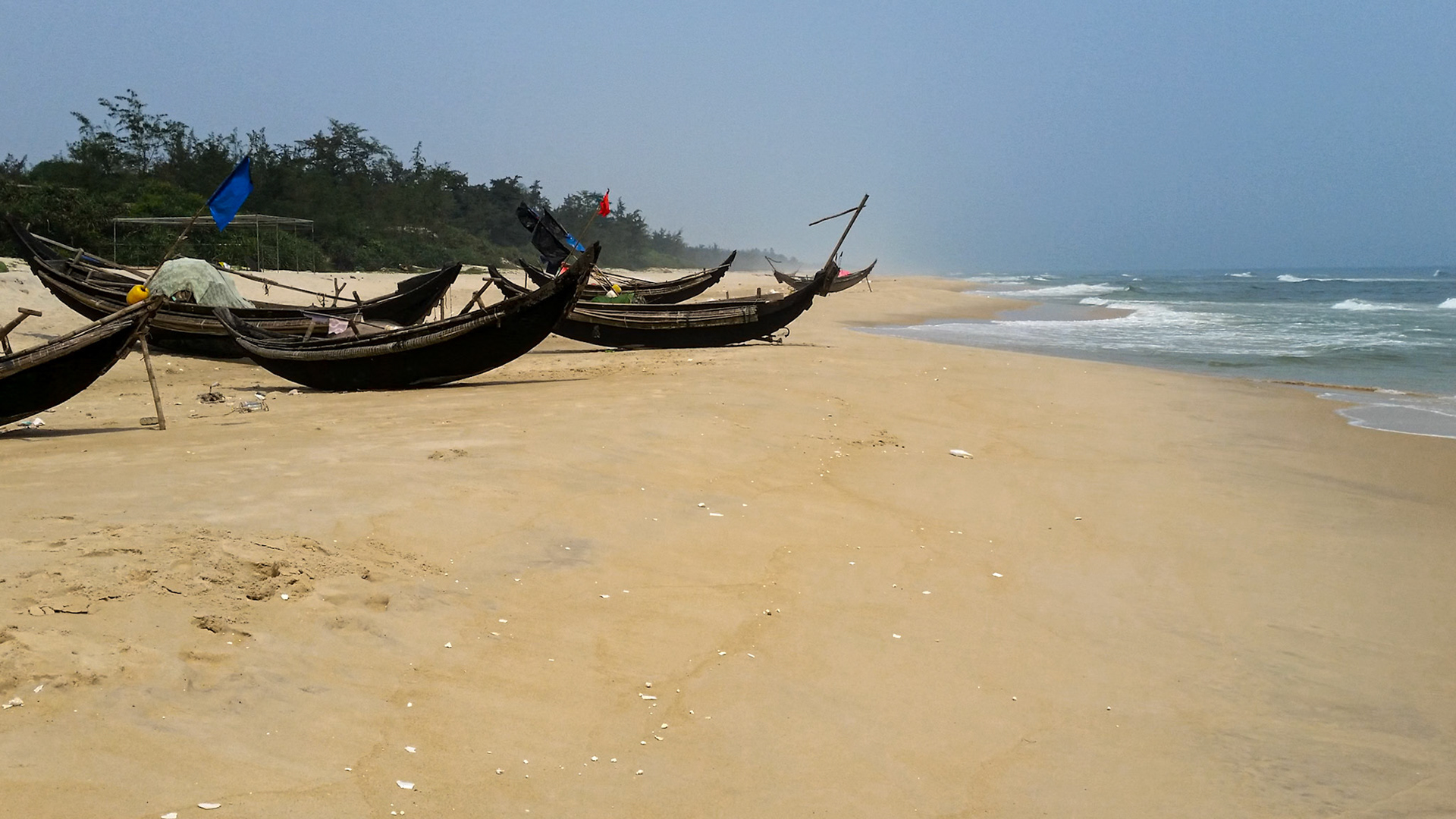 Traditional fishing boats on Tuan An beach.