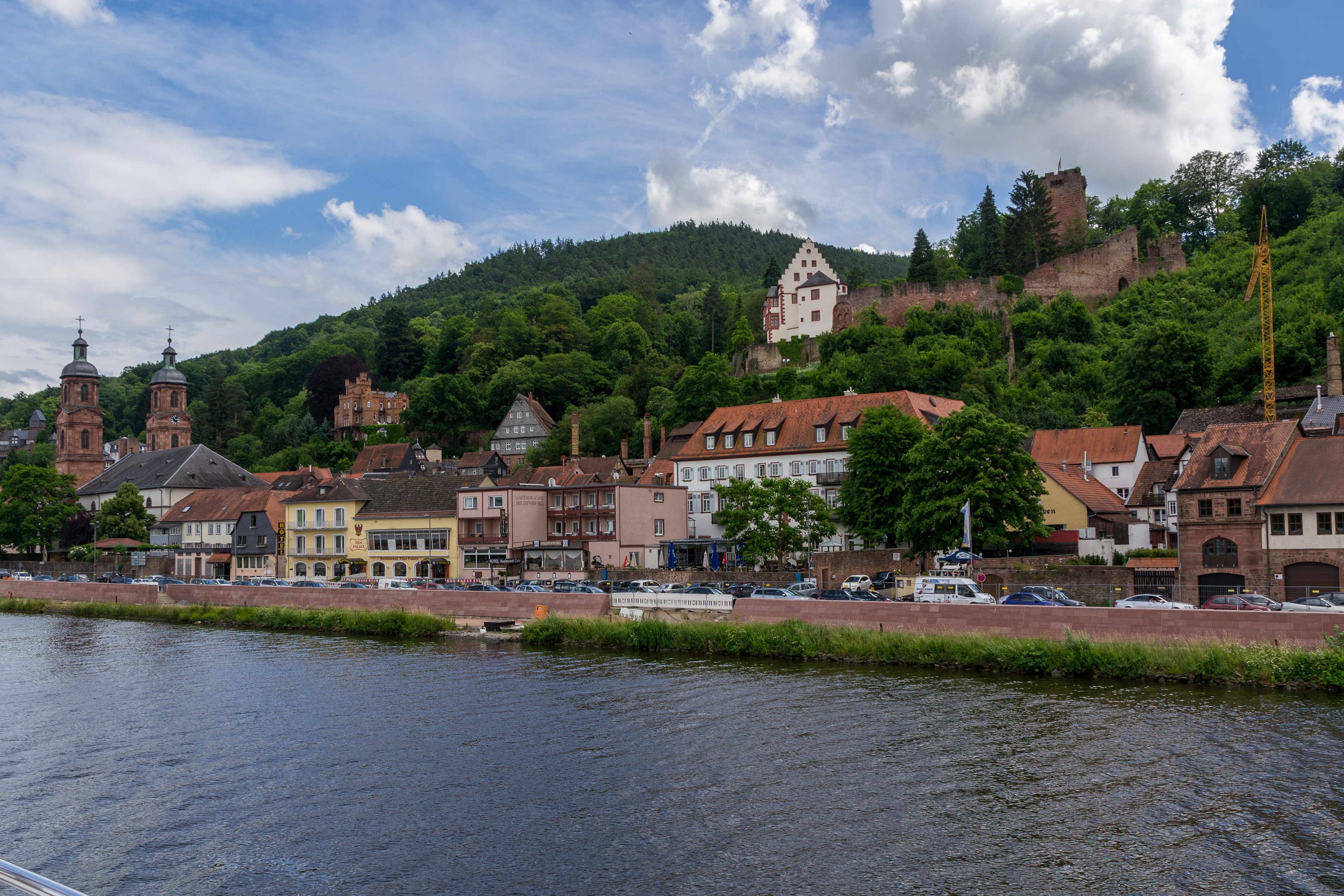 A view of Miltenberg from the Main River. St Jakobus church on the left and castle ruins above the town.