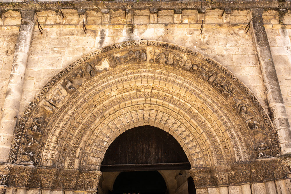 Intriguing carvings above the arched doorway, supposedly representing occupations of the regions parishoners.