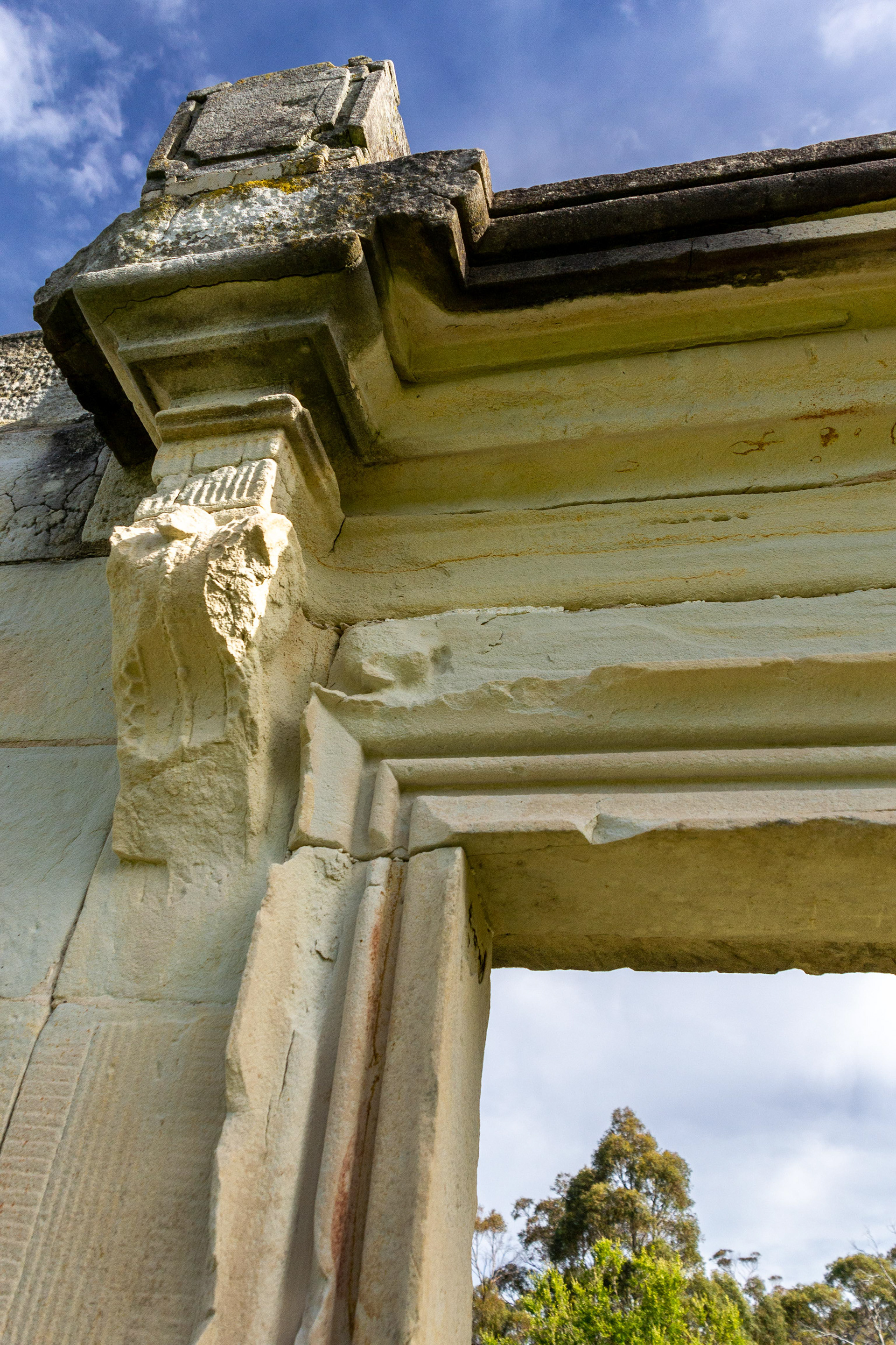 Carved sandstone lintels frame the openings hinting to the grandeur of the officers quarters.