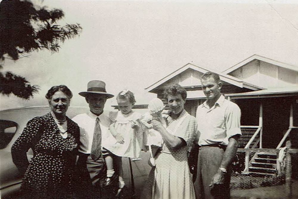 Granny Cavanagh, Bill holding Lorraine, Marie with Ross and Ed in front of our first family home, Biloela farm.