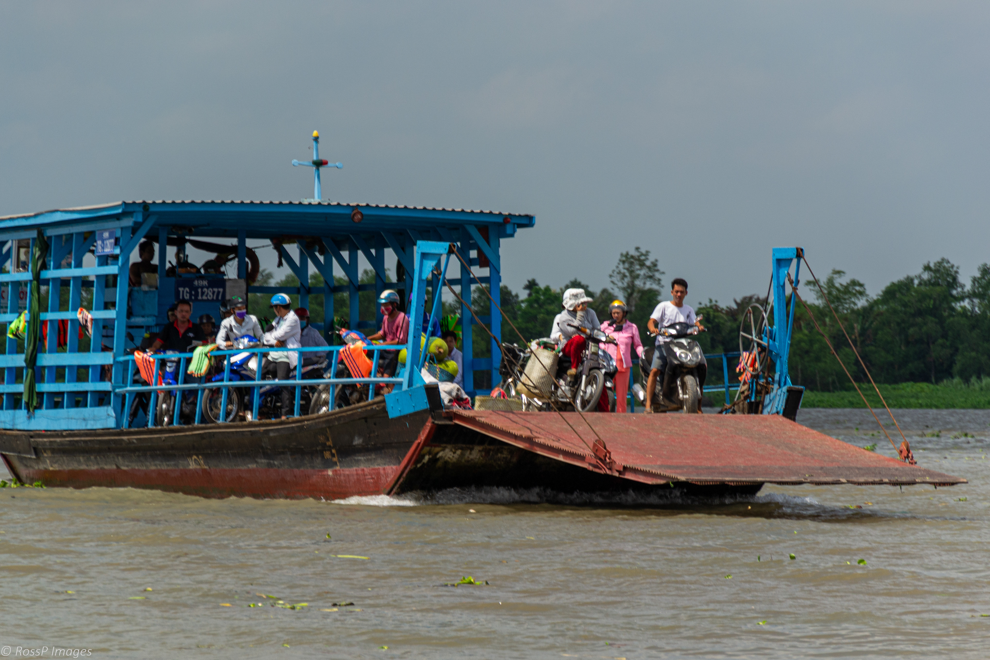 Ferry crossing the Mekong River near Cai Be Village.