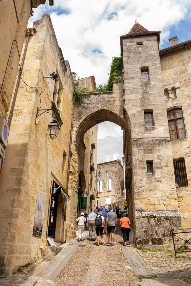 Our group passing through La Porte de la Cadene on the way to the square at the top of the Monolithic Church.