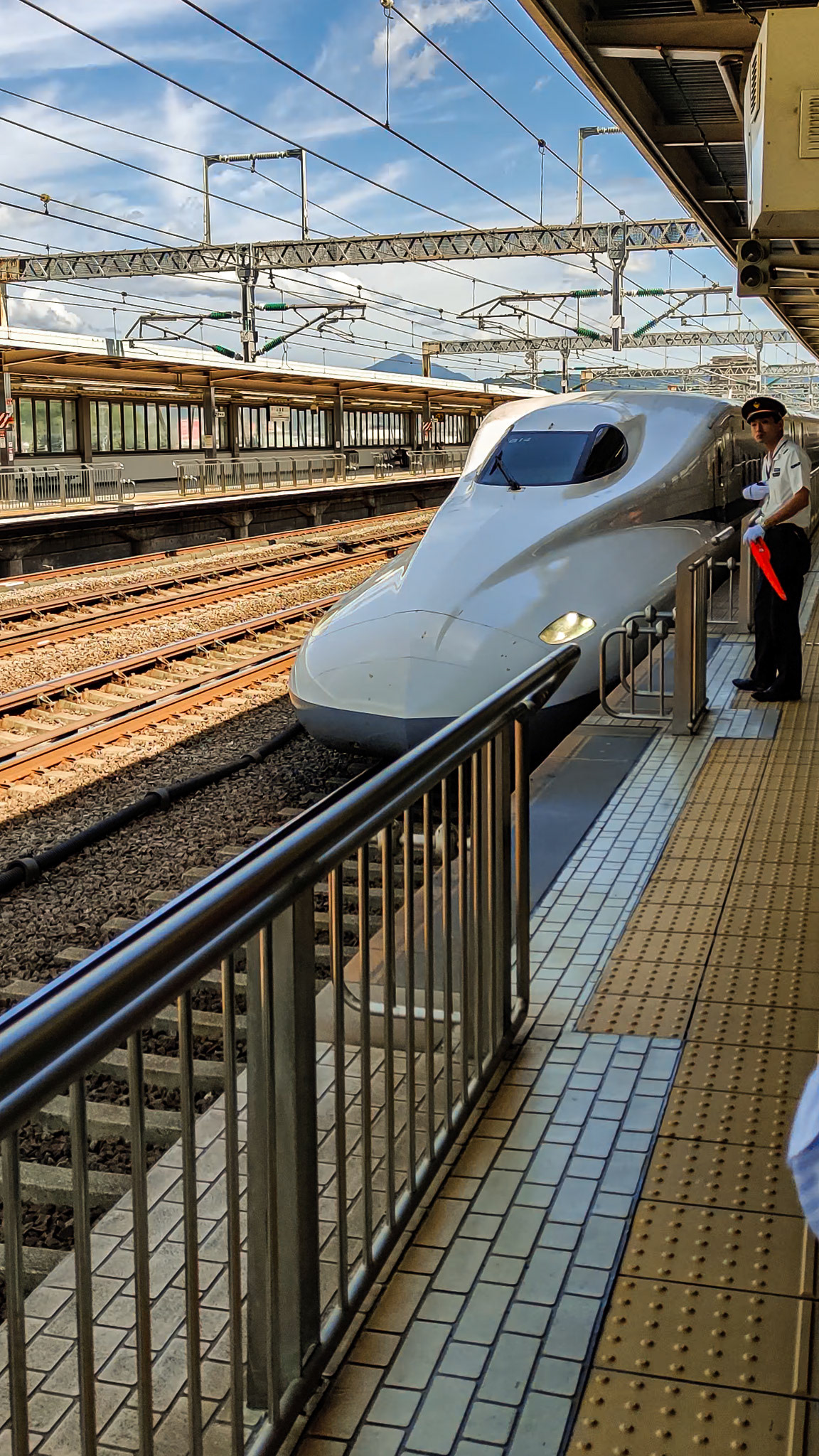 The Shinkansen Bullet-train glides silently into the station.