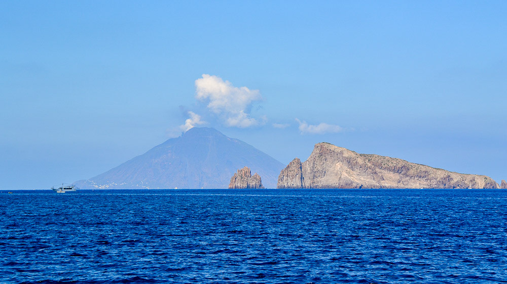 Basiluzzo, the smallest of the Aeolian Islands with Stromboli in the background.
