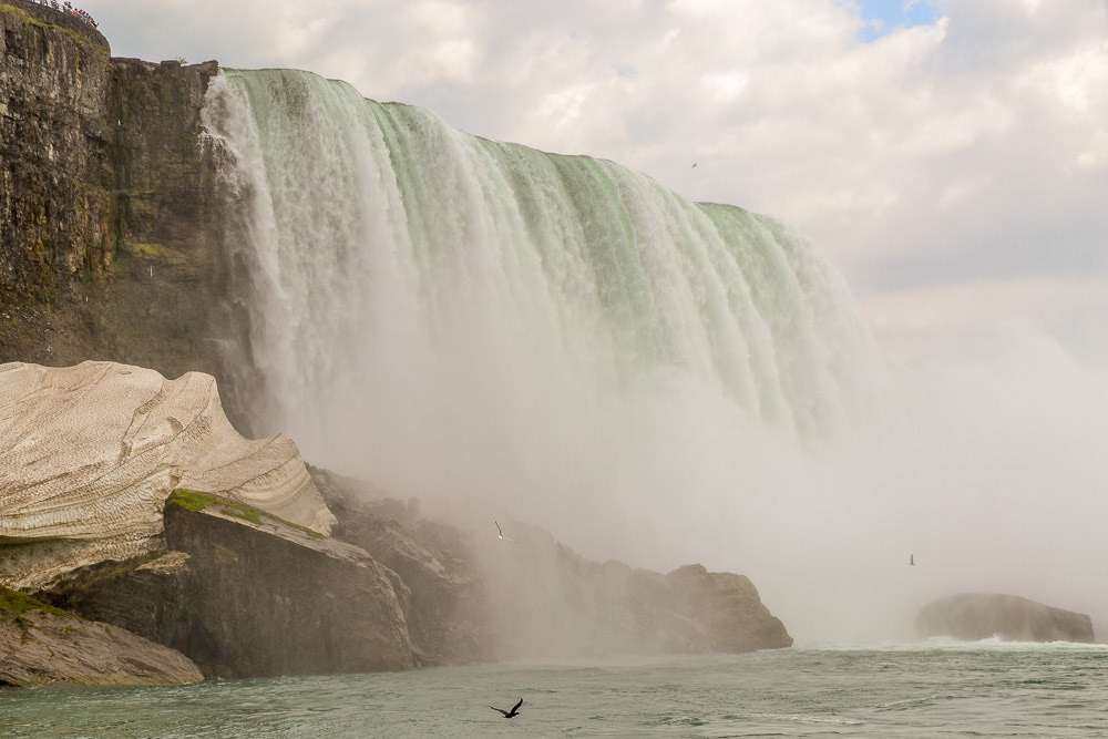 A mound of snow remains at the edge of Horseshoe Falls.