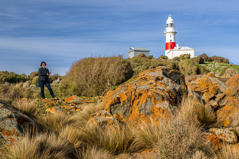 Cheryl stands in front of the Low Head Lighthouse. Commecned operating in 1833 it became Tasmania's second and the third one to be built in Australia.