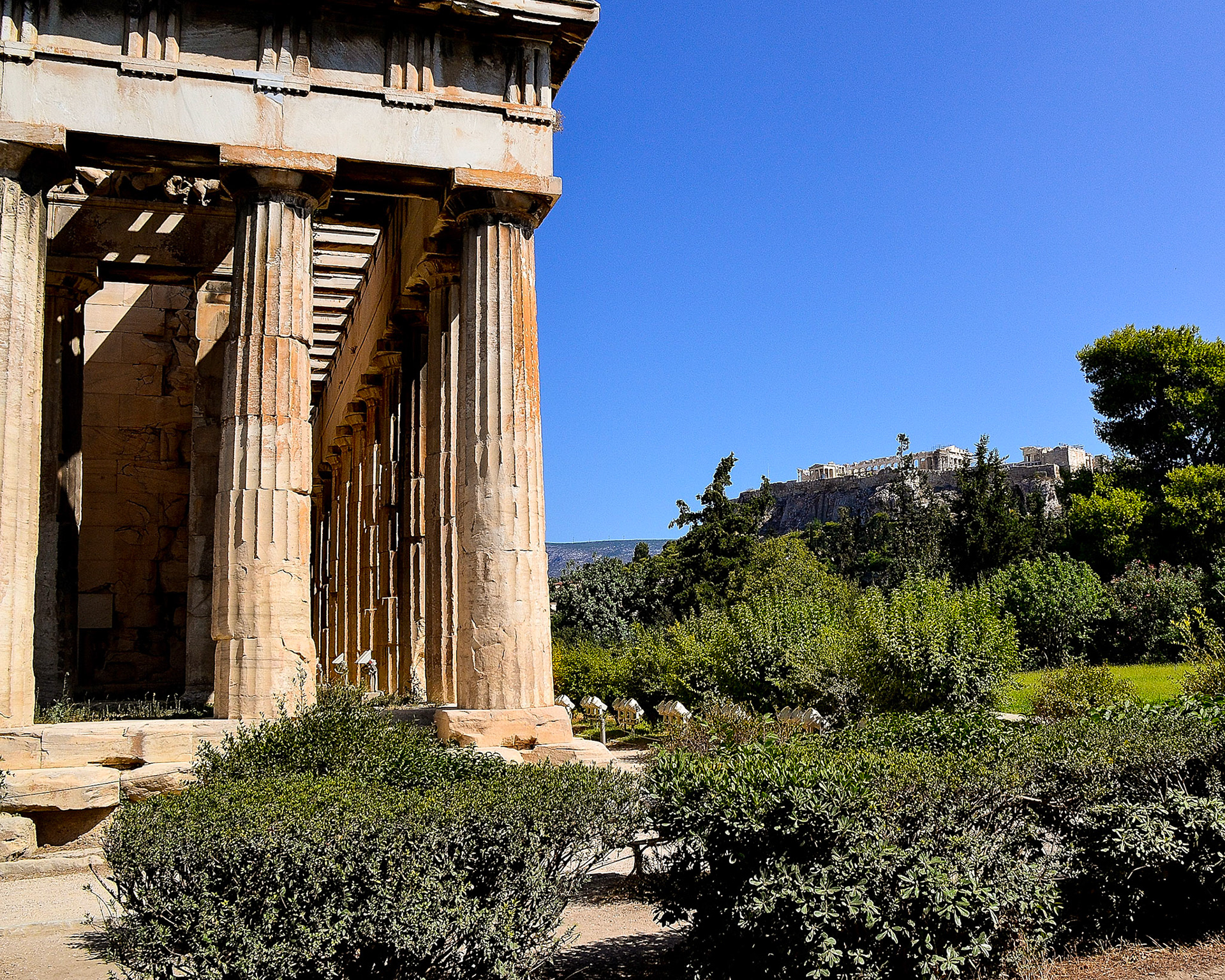 The Parthenon dominates the skyline from atop the Acropolis.