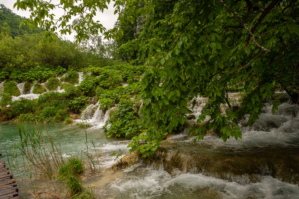 Water cascades over one the travestine banks that separate the lakes.