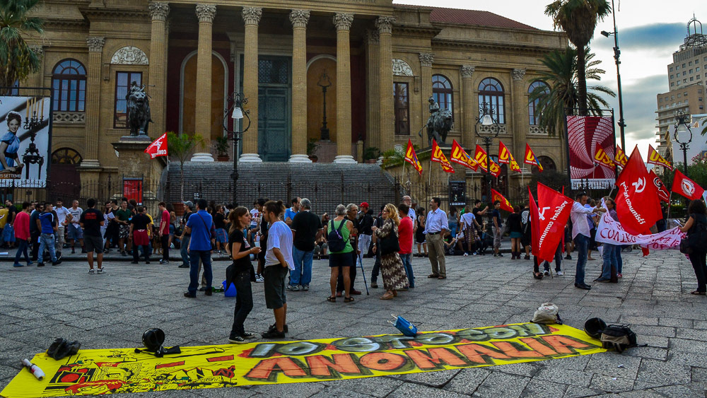 Protestors gather in front of Teatro Massimo.