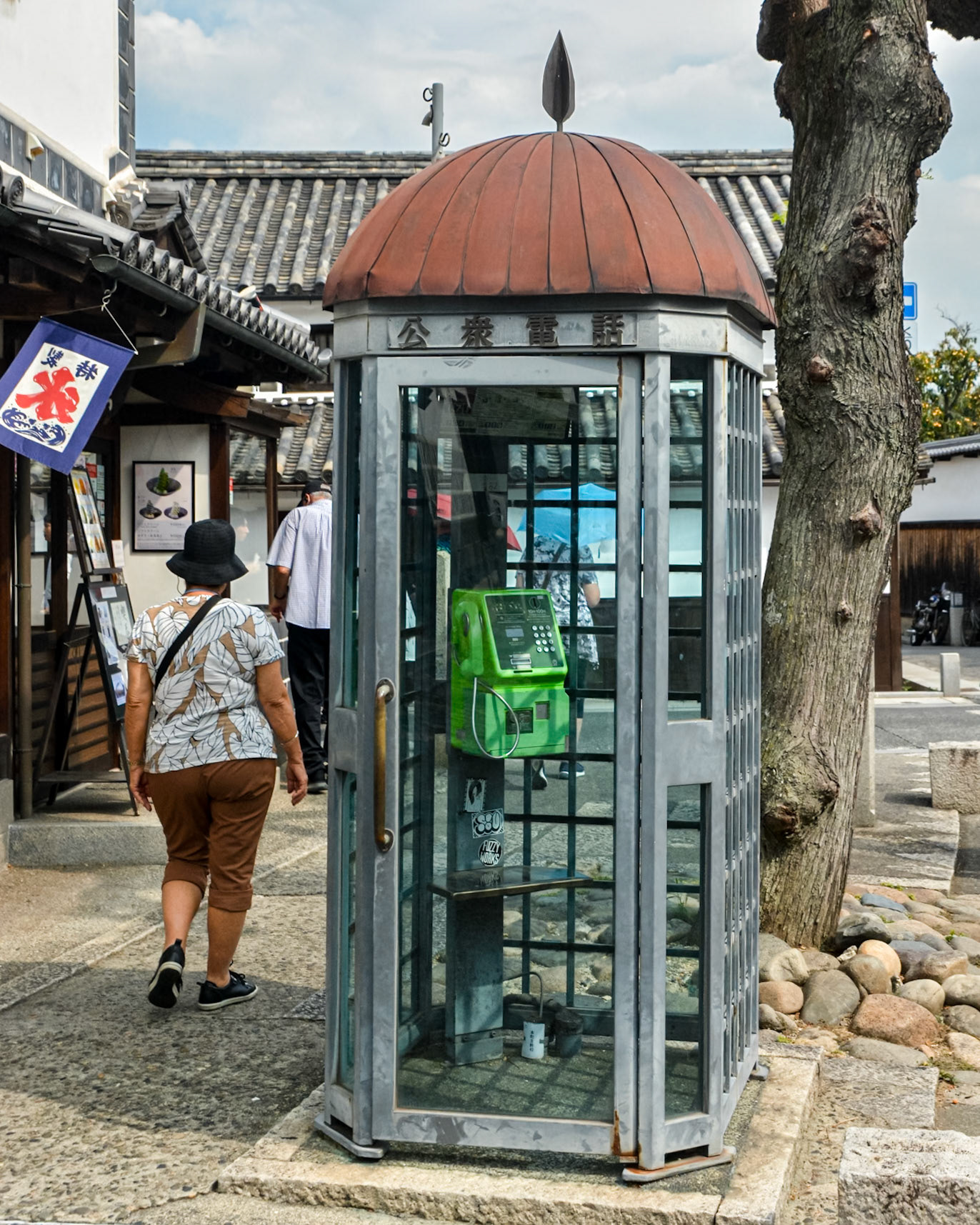 A public phone boot also blends with the period architecture.