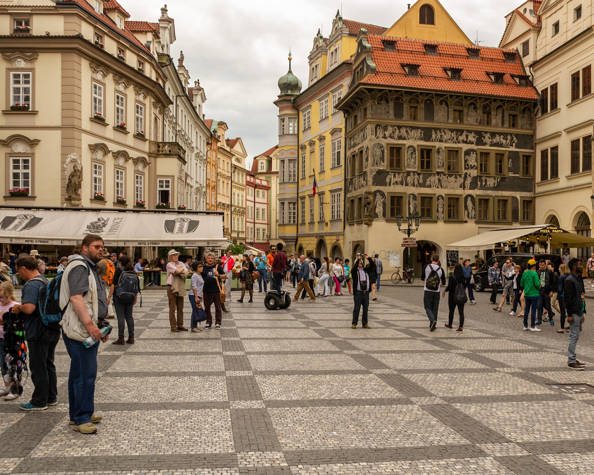 The Old Town Square, a popular gathering place for tourists and buskers.