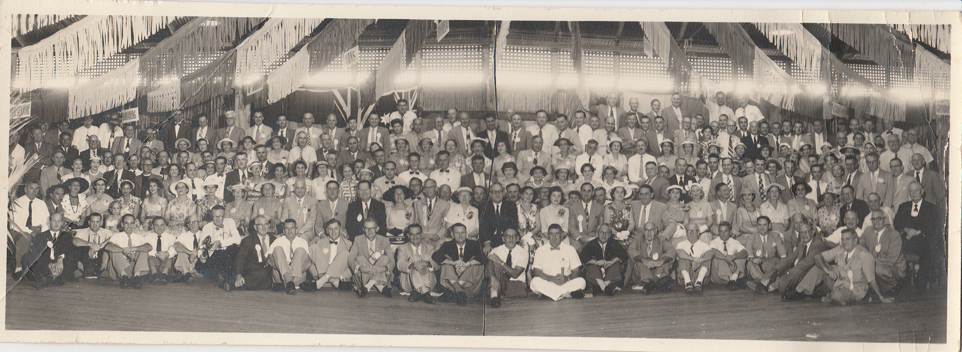 Bill and Marie at a Rotary Convention (date unknown). Bill and Marie are in the 3rd row in the background behind positions 8 an 9 from the right.