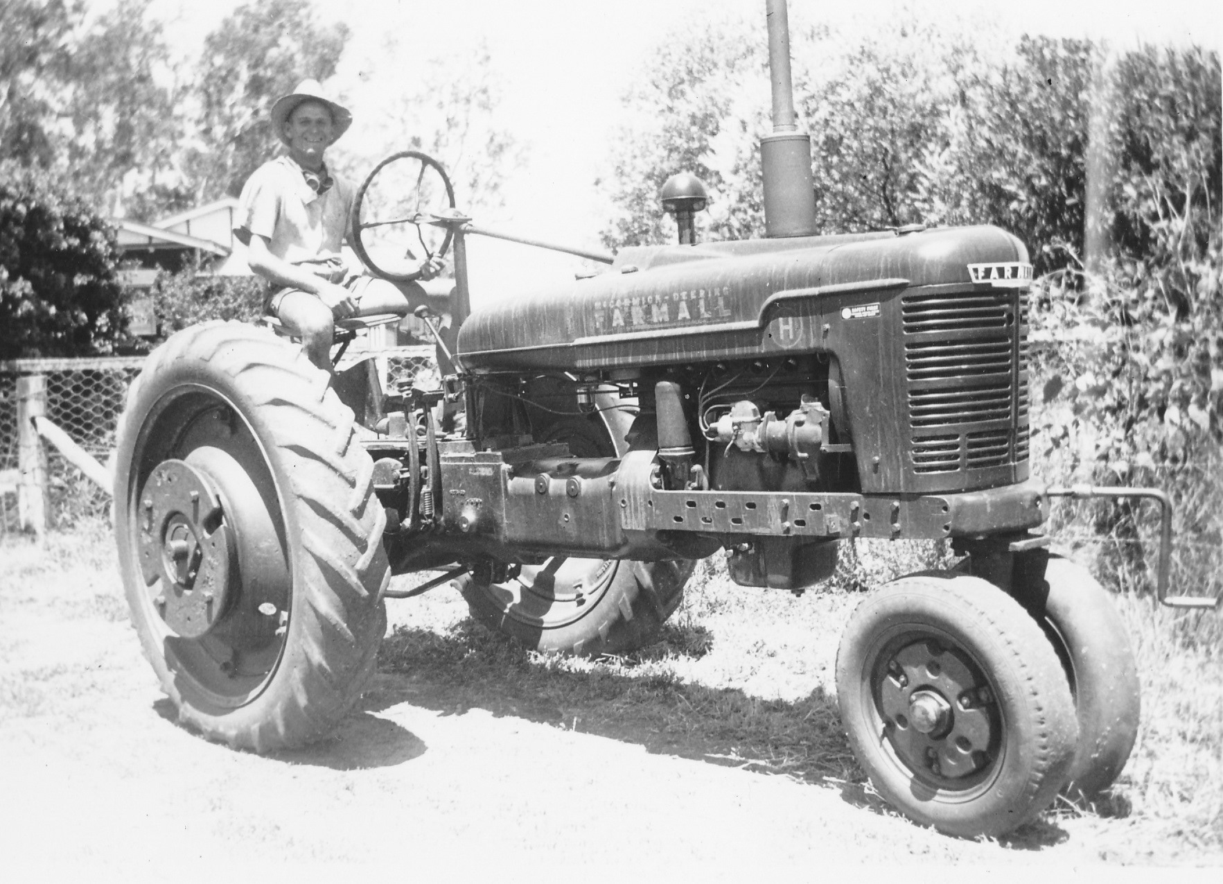 Ed with his first tractor - 1948.