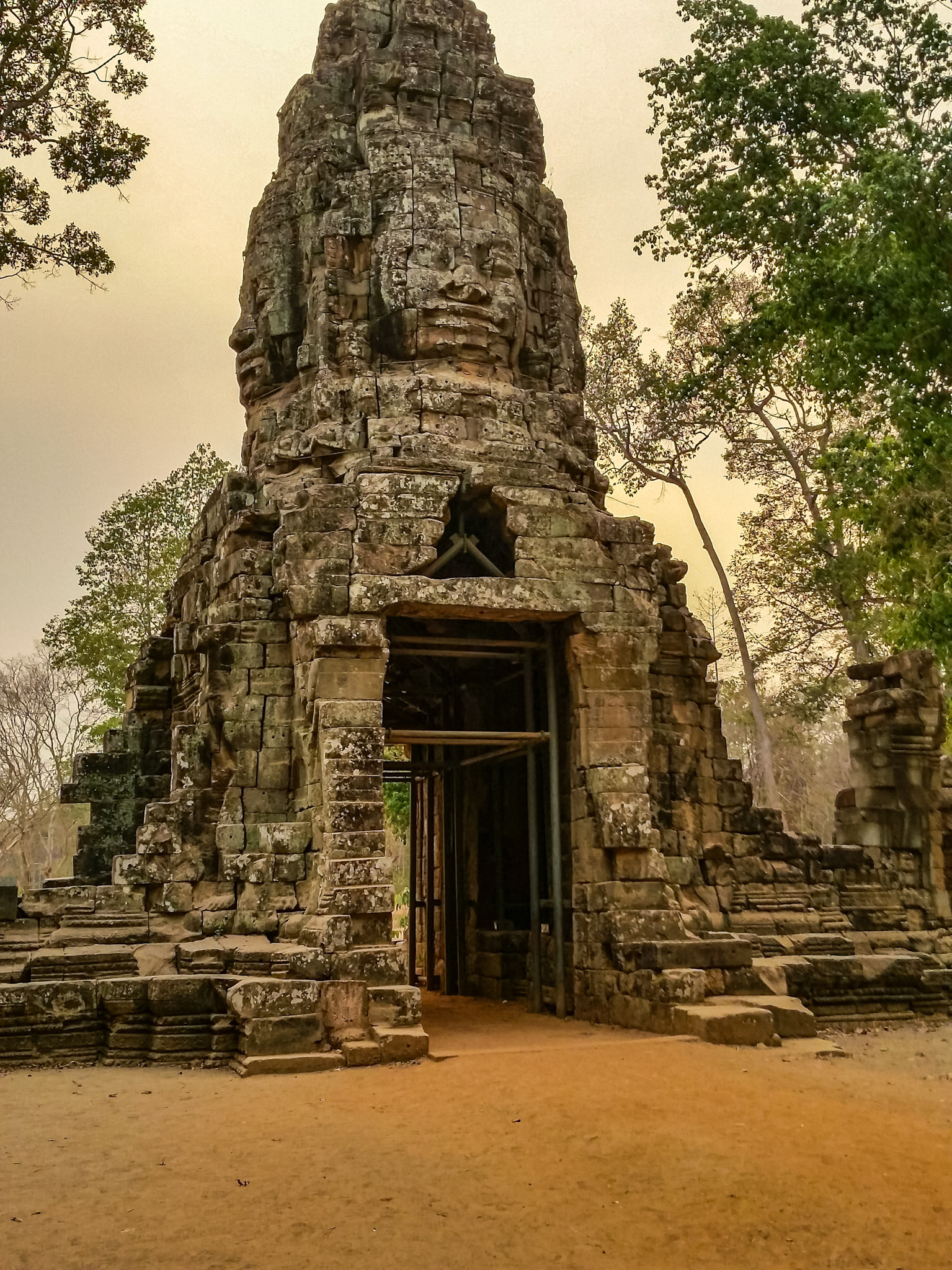 The Western Gate Tower of Ta Prohm backlit by the afternoon sun.