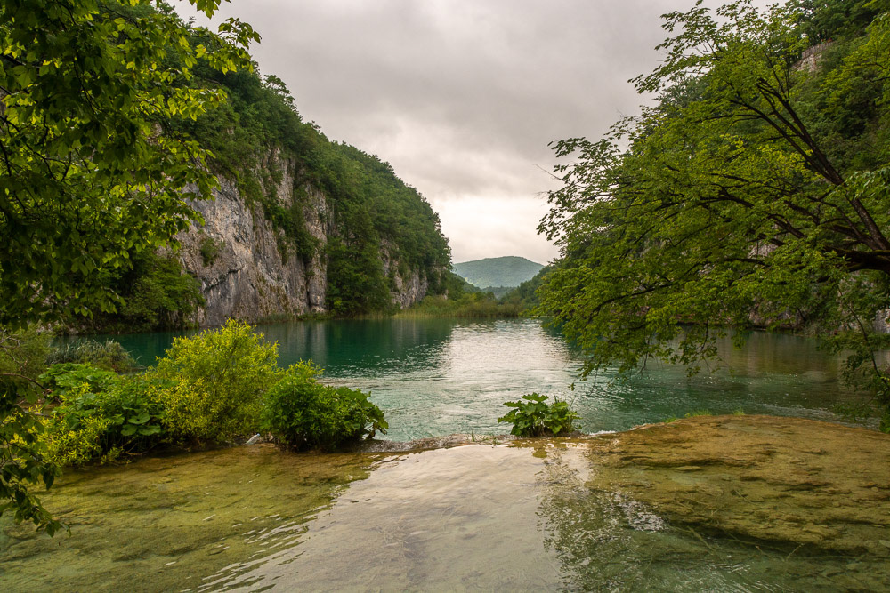 Looking down the canyon over banks and across lakes to distant mountains.