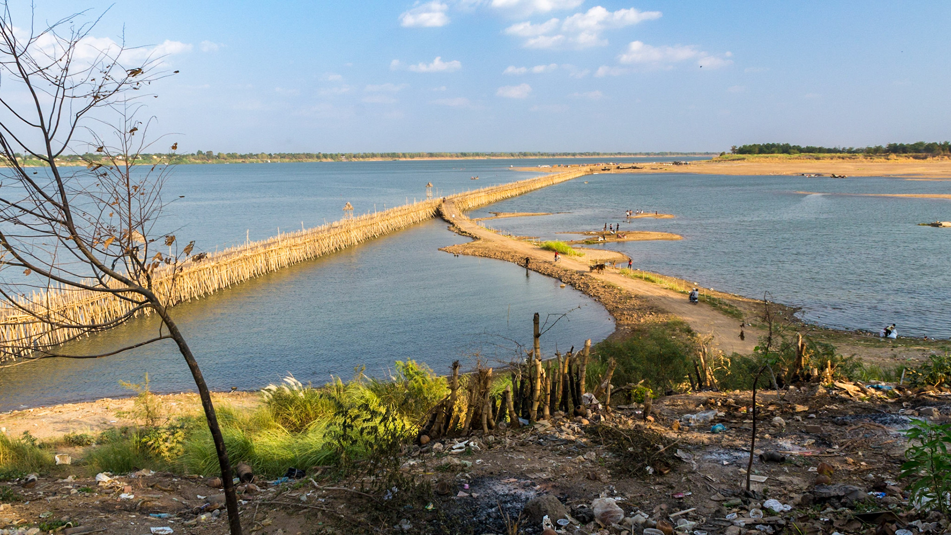 This bamboo bridge stretches across the Mekong to reach Koh Paen Island. It is rebuilt every year in the dry season after being taken down following its removal for the wet season when levels rise in the river.