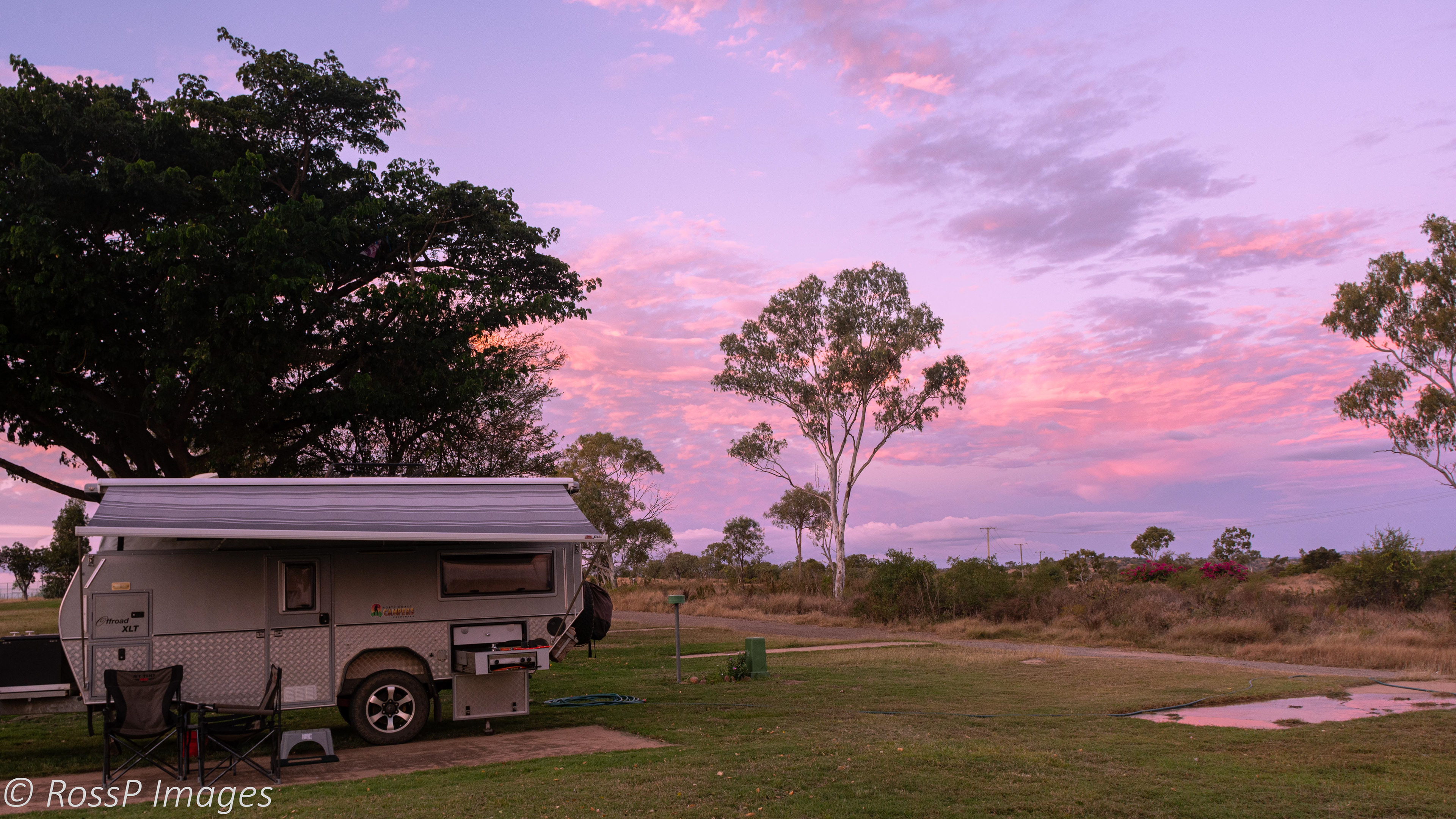 Sunset adds a tinge of pink to the clouds behind the campground.