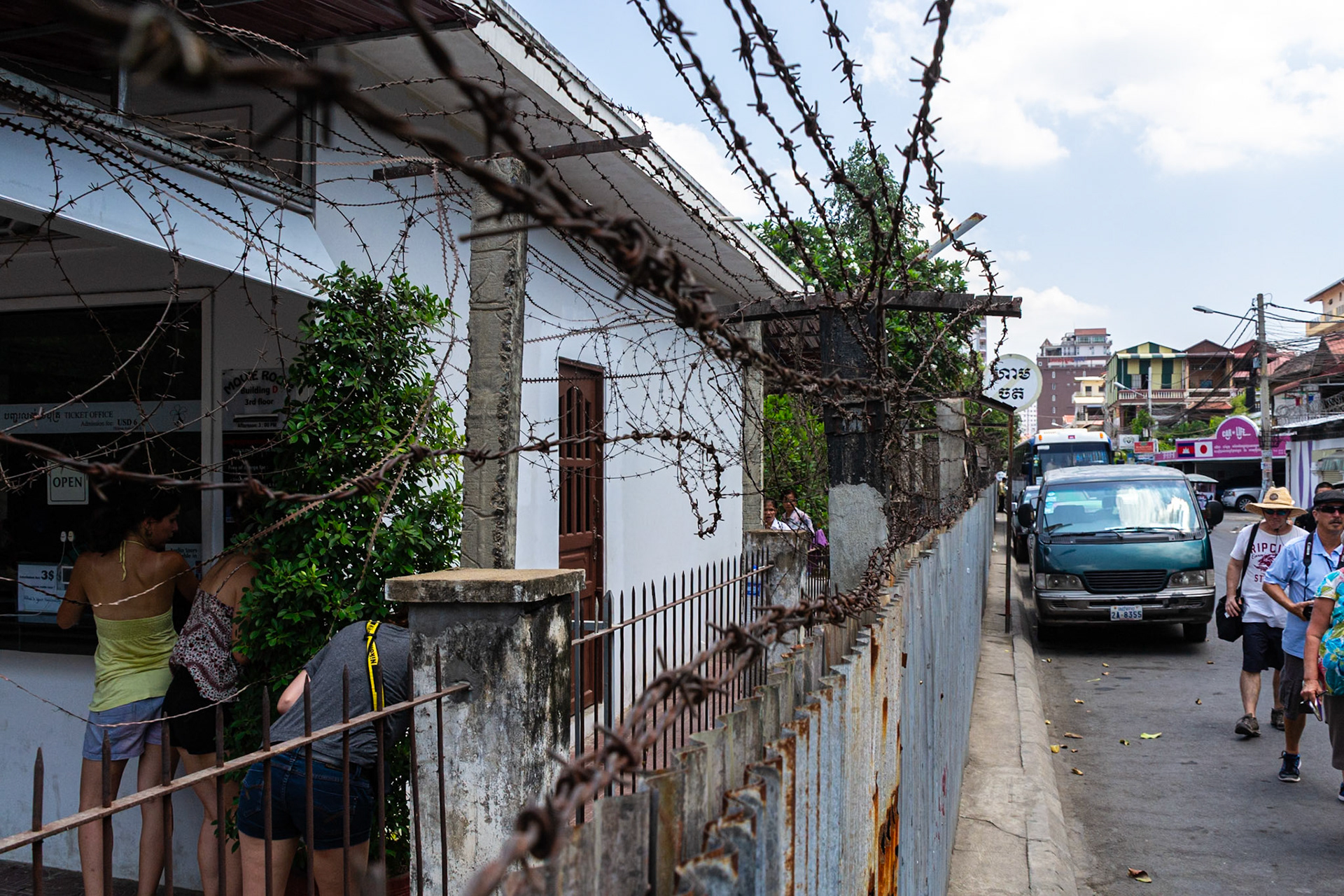 Rusting, tangled barbed wire to the perimeter fencing gives a none too sutle reminder that the premises behind was once a prison.