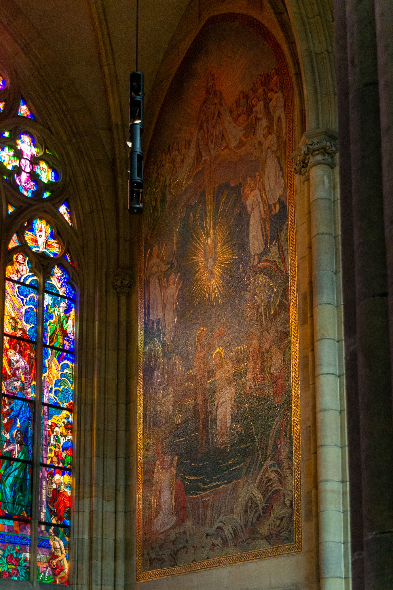 Golden highlights of the holy scenes are excentuated by the light of the nearby leadlight window