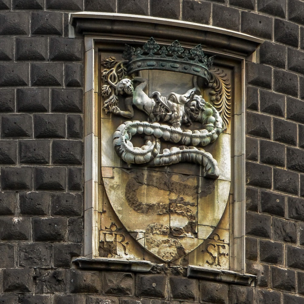 Remnants of the Coat of arms of the House of Visconti. The serpent, a biscione is featured on the Alfa Romeo Logo and has become a symbol of Milano.