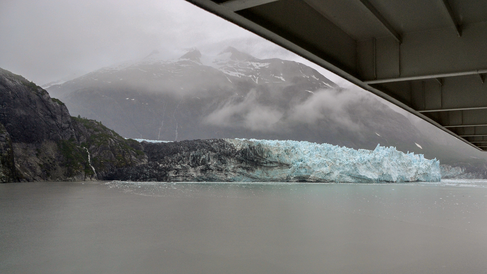 Looming out of the mist on the portside of the ship is Margerie Glacier.