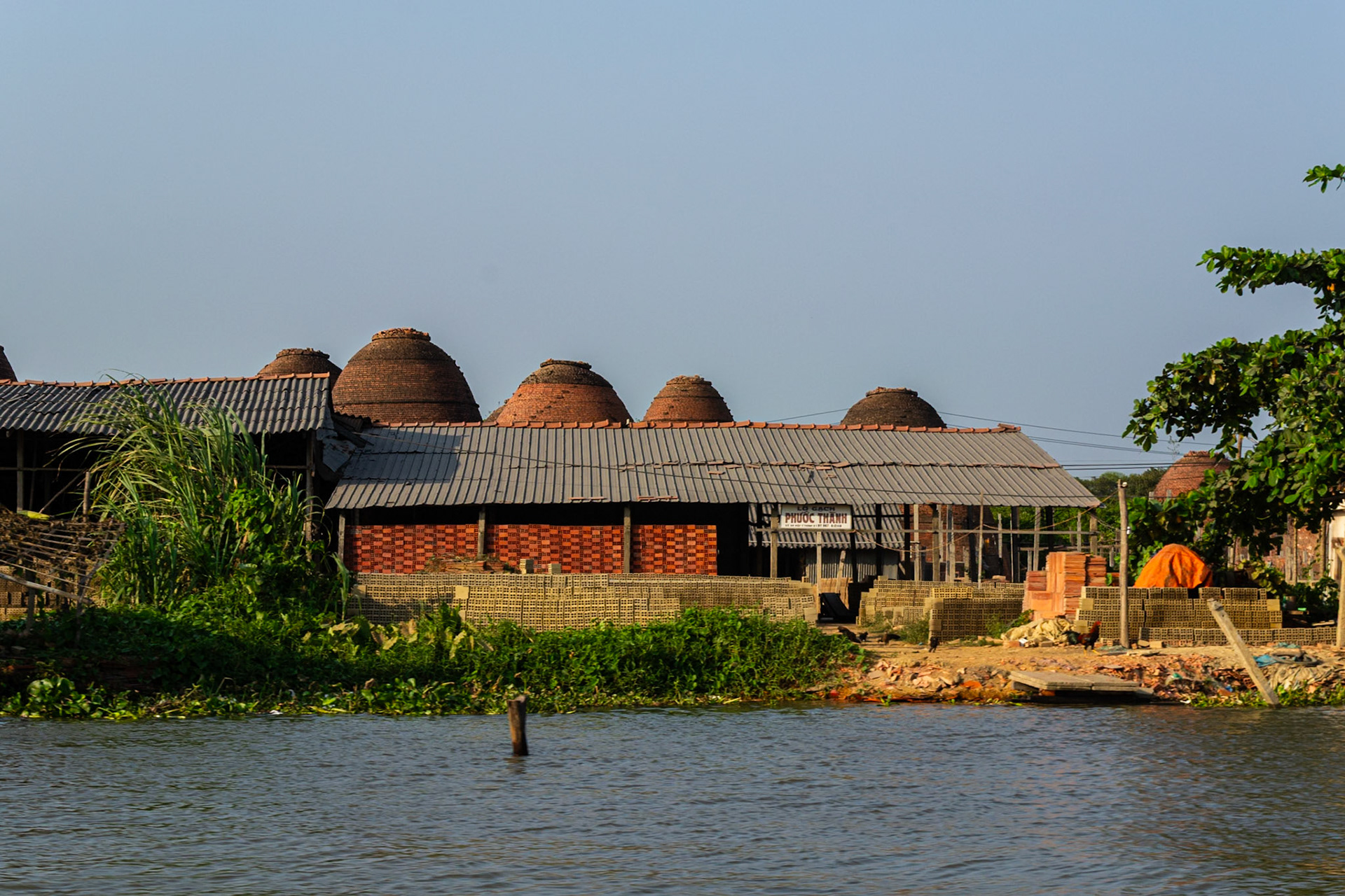 Sa Dec brickworks with kilns protruding above the roofline.