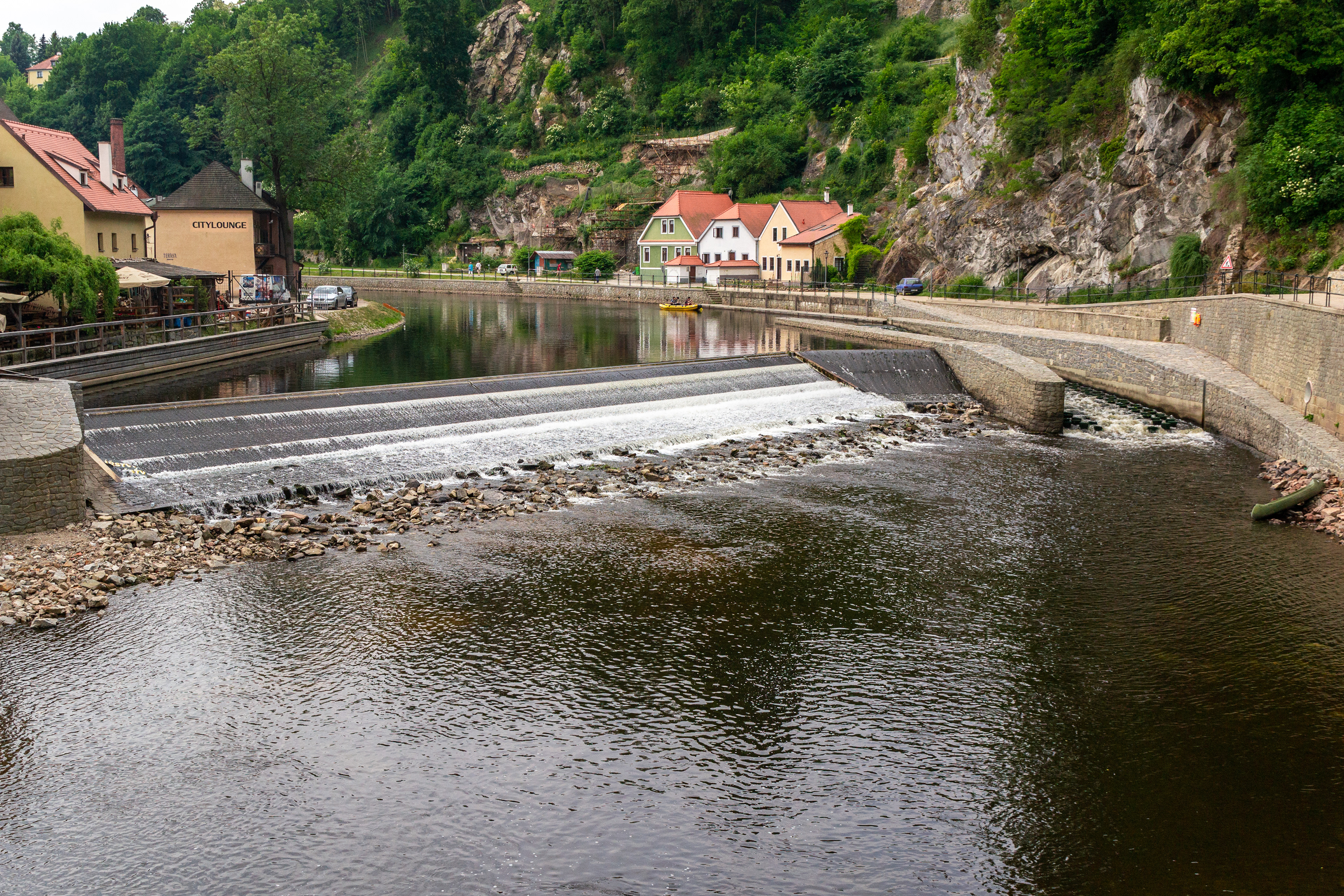The Vltava river's horseshoe bend flowing around the old town area.