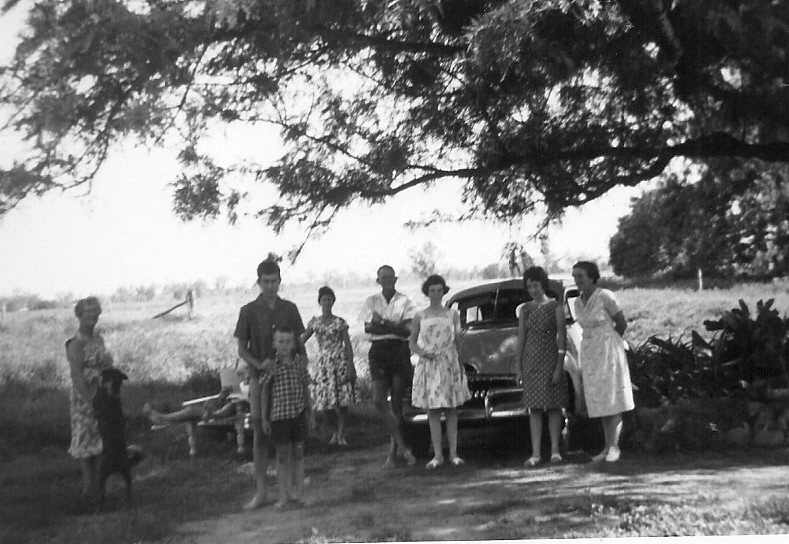 Marie (holding "Nigger") with Ross and Wayne Kerwin, Nell, Ed and Elaine, Irene and Mable Reid. Bill relaxing in the squatter's chair in the background.