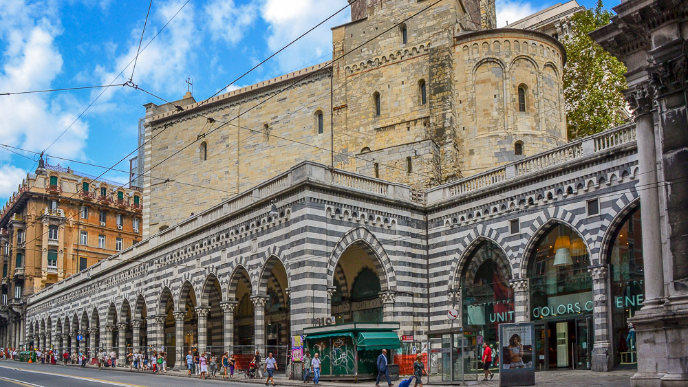 The Church of St. Stephen above the porticoes of the upper part of Via XX Settembre.