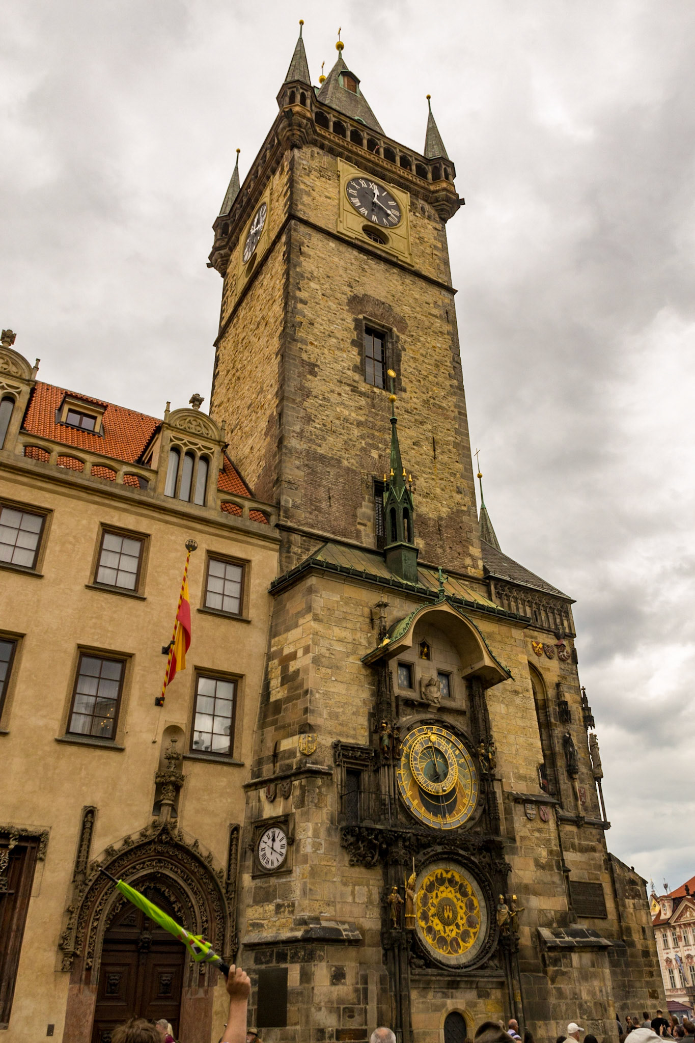Orloj is mounted on the southern wall of Old Town Hall in the Old Town Square. The clock mechanism itself has three main components: the astronomical dial, representing the position of the Sun and Moon in the sky and displaying various astronomical details; statues of various Catholic saints stand on either side of the clock; "The Walk of the Apostles", a clockwork hourly show of figures of the Apostles and other moving sculptures—notably a figure of Death (represented by a skeleton) striking the time; and a calendar dial with medallions representing the months.