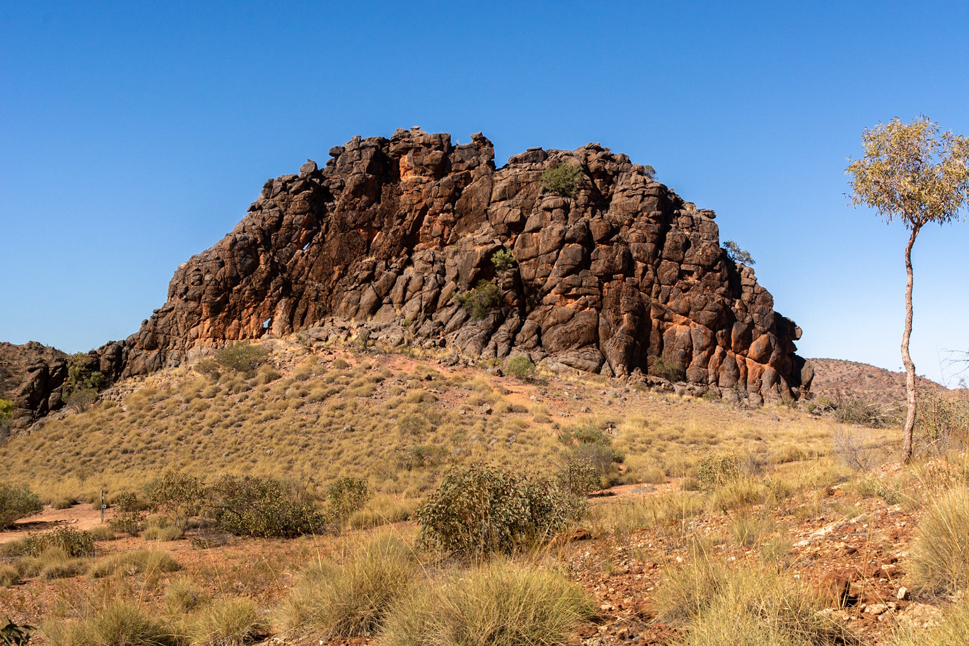 Coroboree Rock - This amazing column of grey dolomite rock stands prominently above the adjacent landscape.