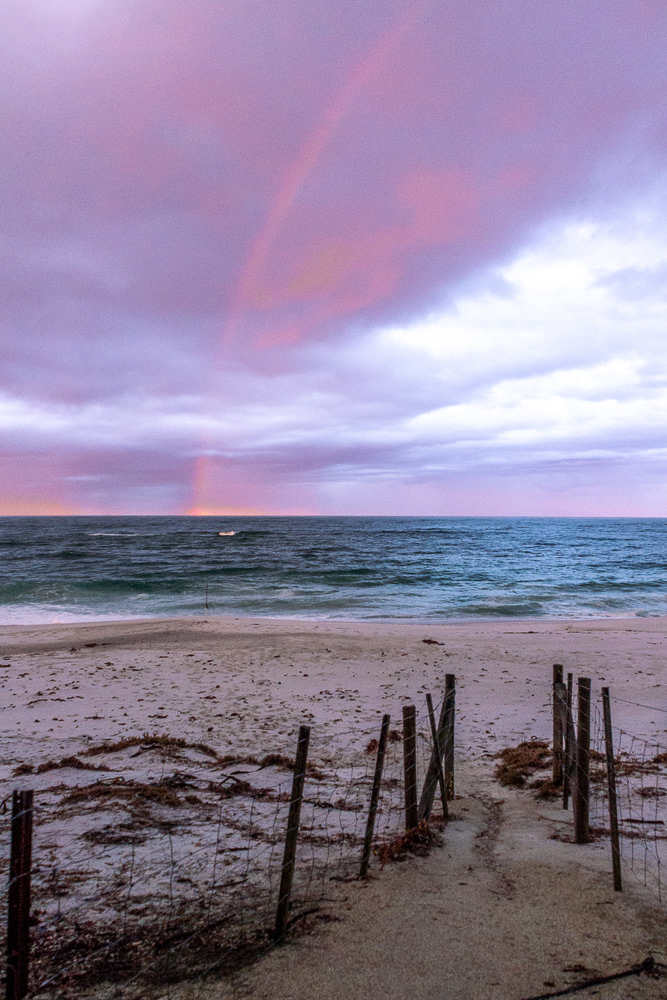 "After the storm" - a rainbow meets the horizon east of Big Musselroe Bay.