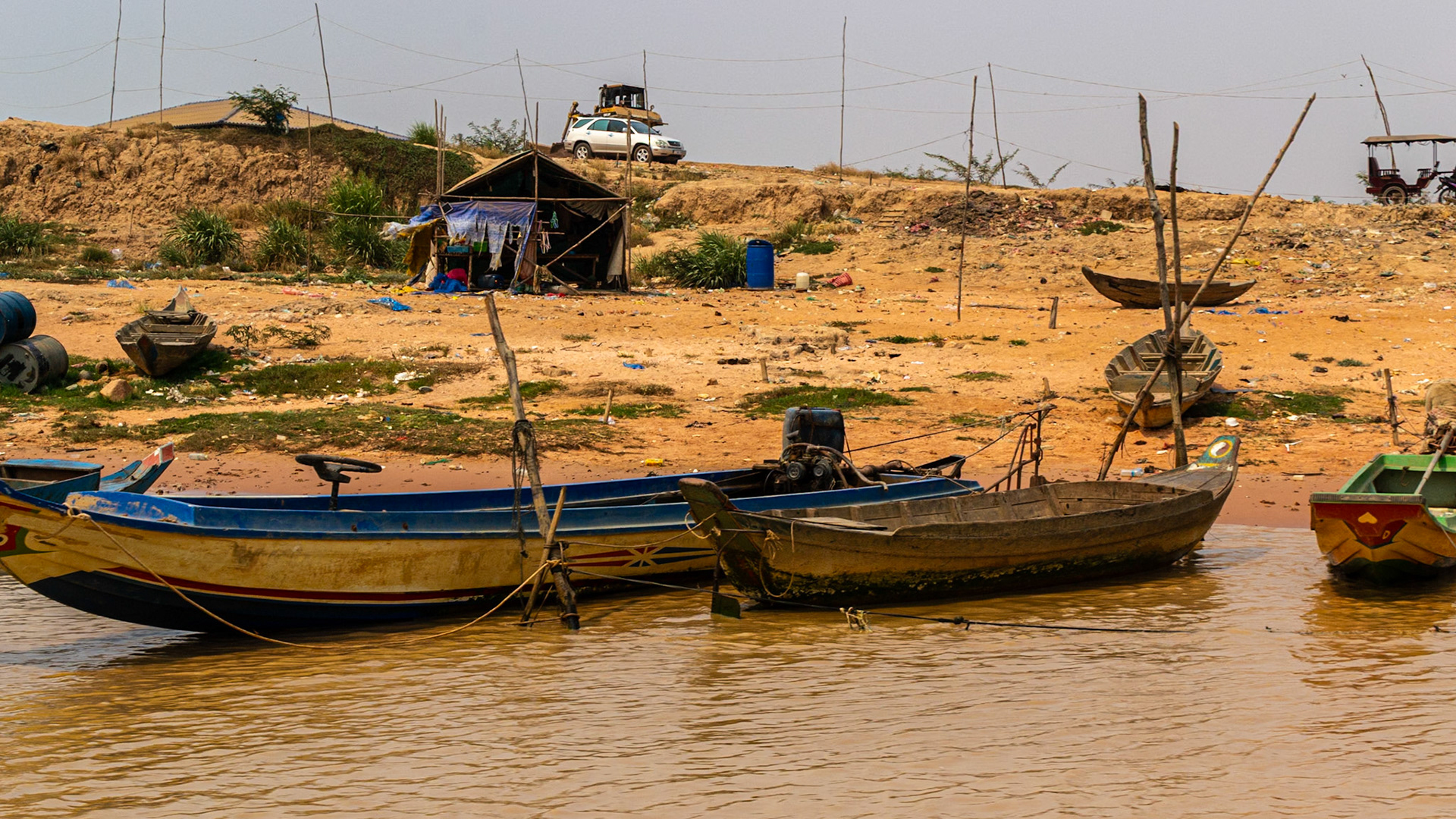 Temporary Shanty houses pop up in what was once the river bed.