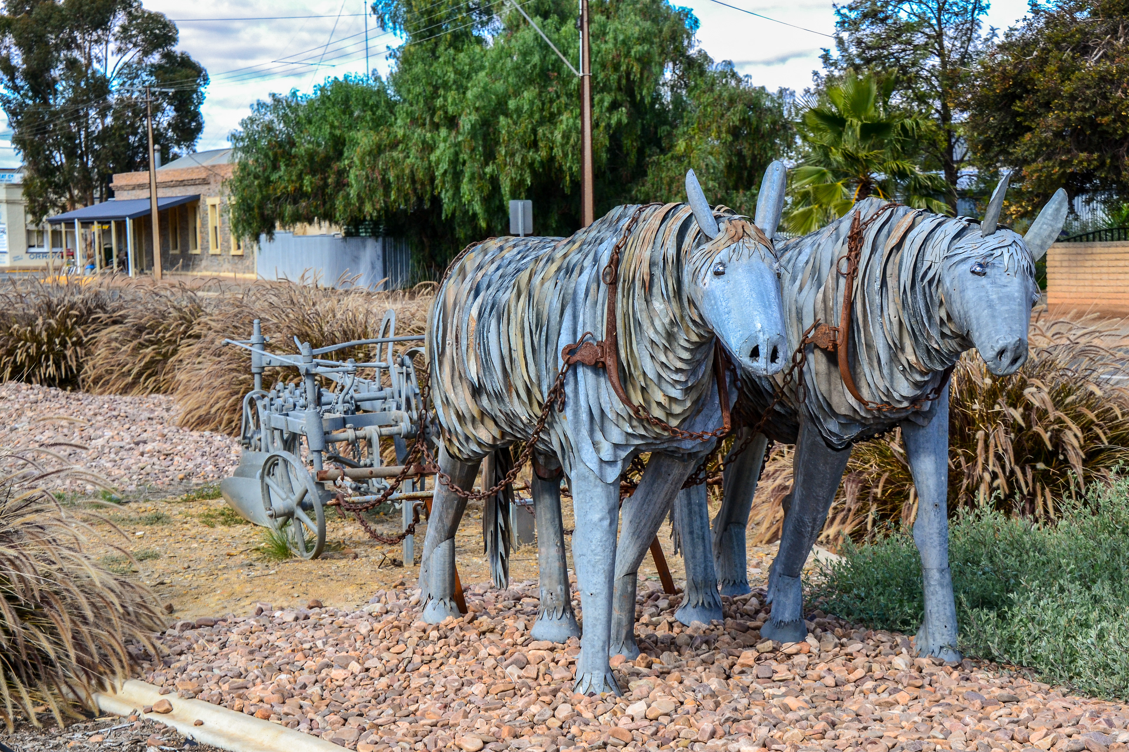 Street Sculpture of draught horse team pulling a Forbes three furrow stump jump plough, Orroroo.